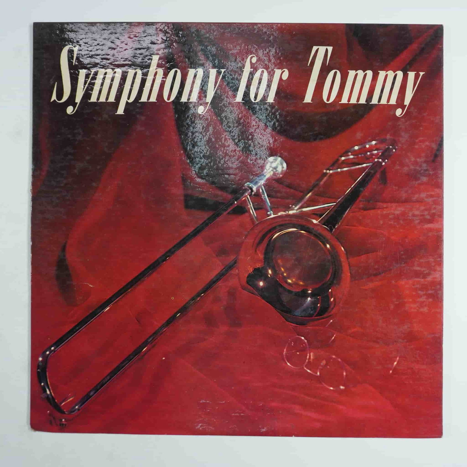 The Hamburg Philharmonia Orchestra, Symphony for Tommy Vinyl Record: This vintage vinyl record, Symphony for Tommy, features The Hamburg Philharmonia Orchestra and is scored by Joseph Kuhn. Released under the Trans-World label (TWLP 213), this high-fidelity LP pays tri