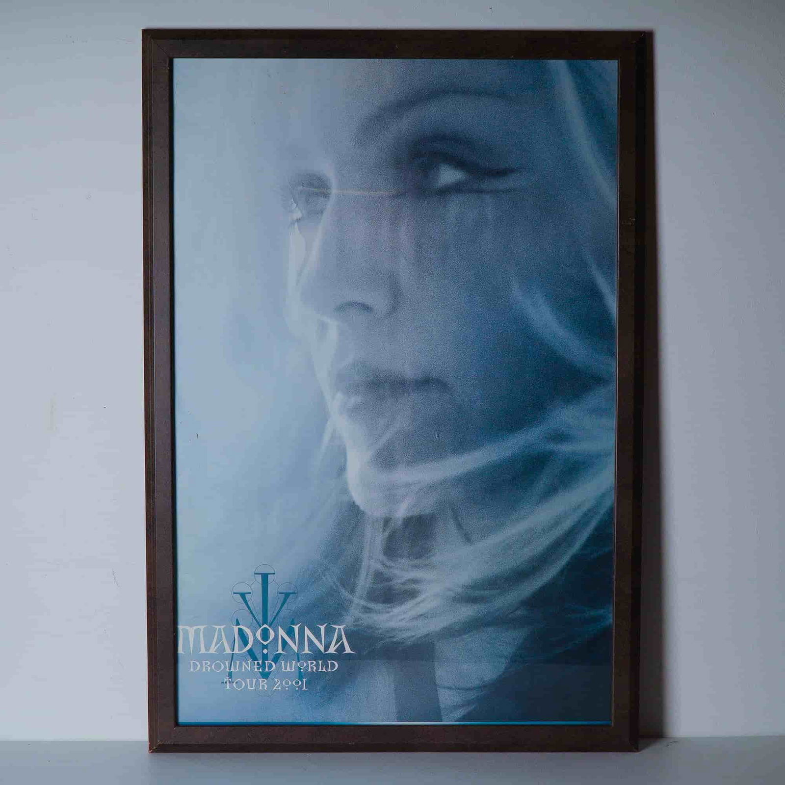 Madonna Drowned World Tour 2001 Framed Promotional Poster: A striking original framed poster from Madonna's iconic Drowned World Tour 2001, her first concert tour in eight years following The Girlie Show. The tour took its name from her Ray of Light track Dro