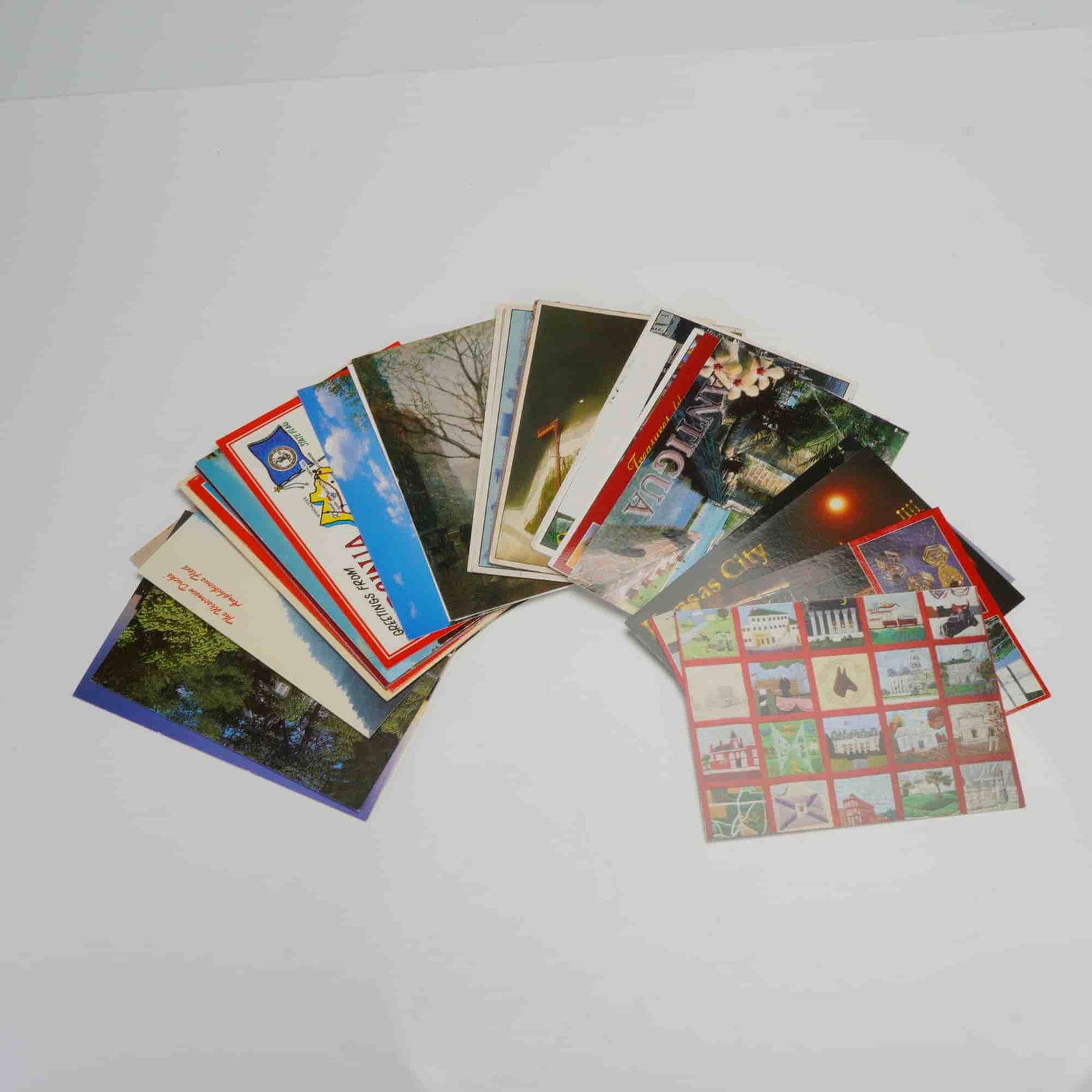 36pc Assorted Travel and Scenic Postcards: A varied assemblage featuring diverse themes such as travel destinations, scenic landscapes, and regional attractions. Includes cards from Kansas, City, St. Louis, Virginia, Albuquerque, Brazil, and