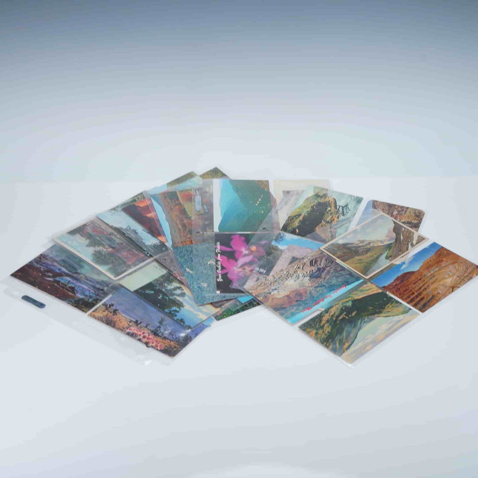 40pc Postcard Collection of American Natural Landmarks & More: This collection of 40 postcards showcases stunning natural American landmarks, with vibrant images of mountains, rivers, and other iconic landscapes. Included are postcards from various states,
