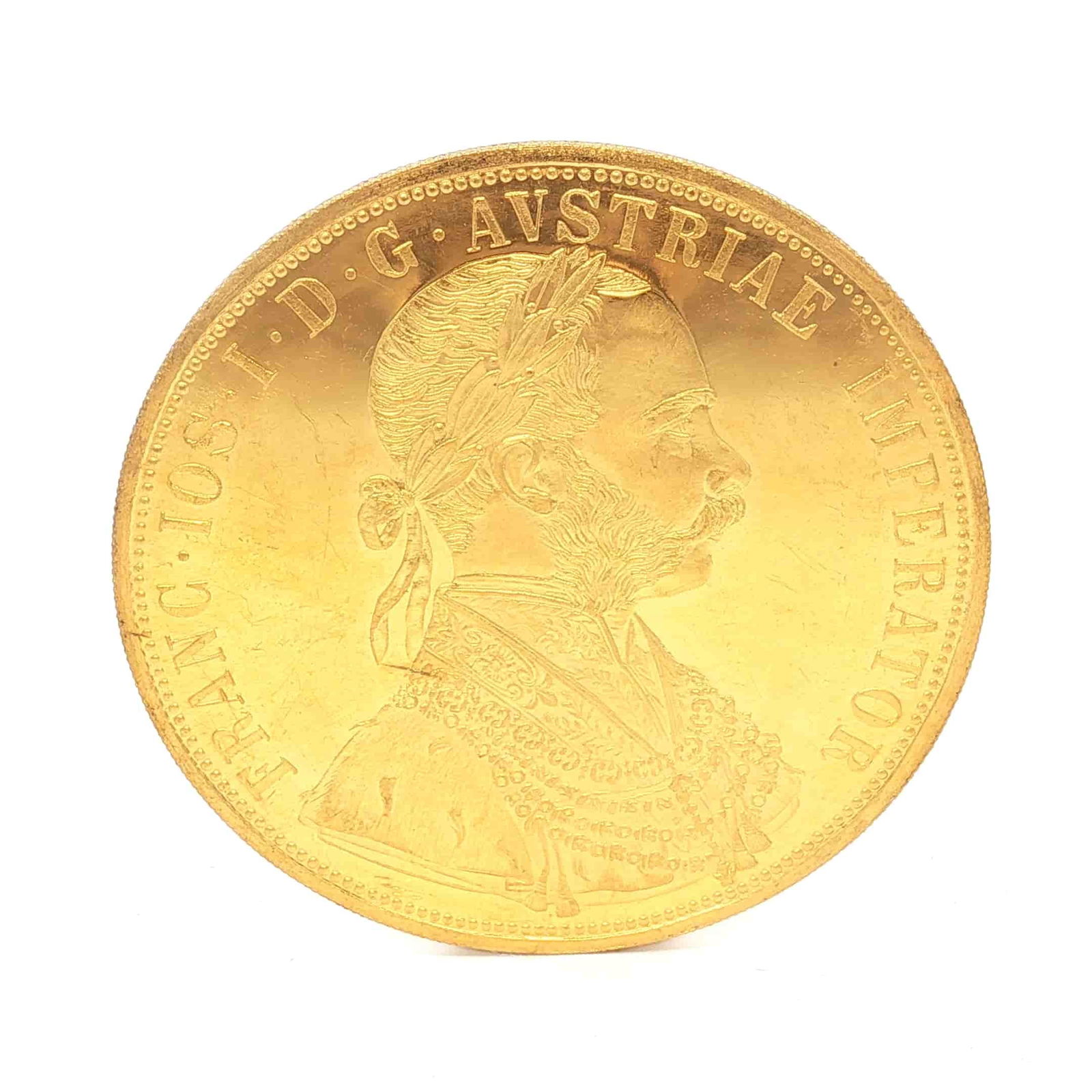 1915 Austrian 4 Ducats Franz Joseph I Replica Gold Bullion: The obverse features a portrait of Franz Joseph I facing right, with a control mark positioned in the left field. The reverse displays the coat of arms of Austria encircled by an order and supported