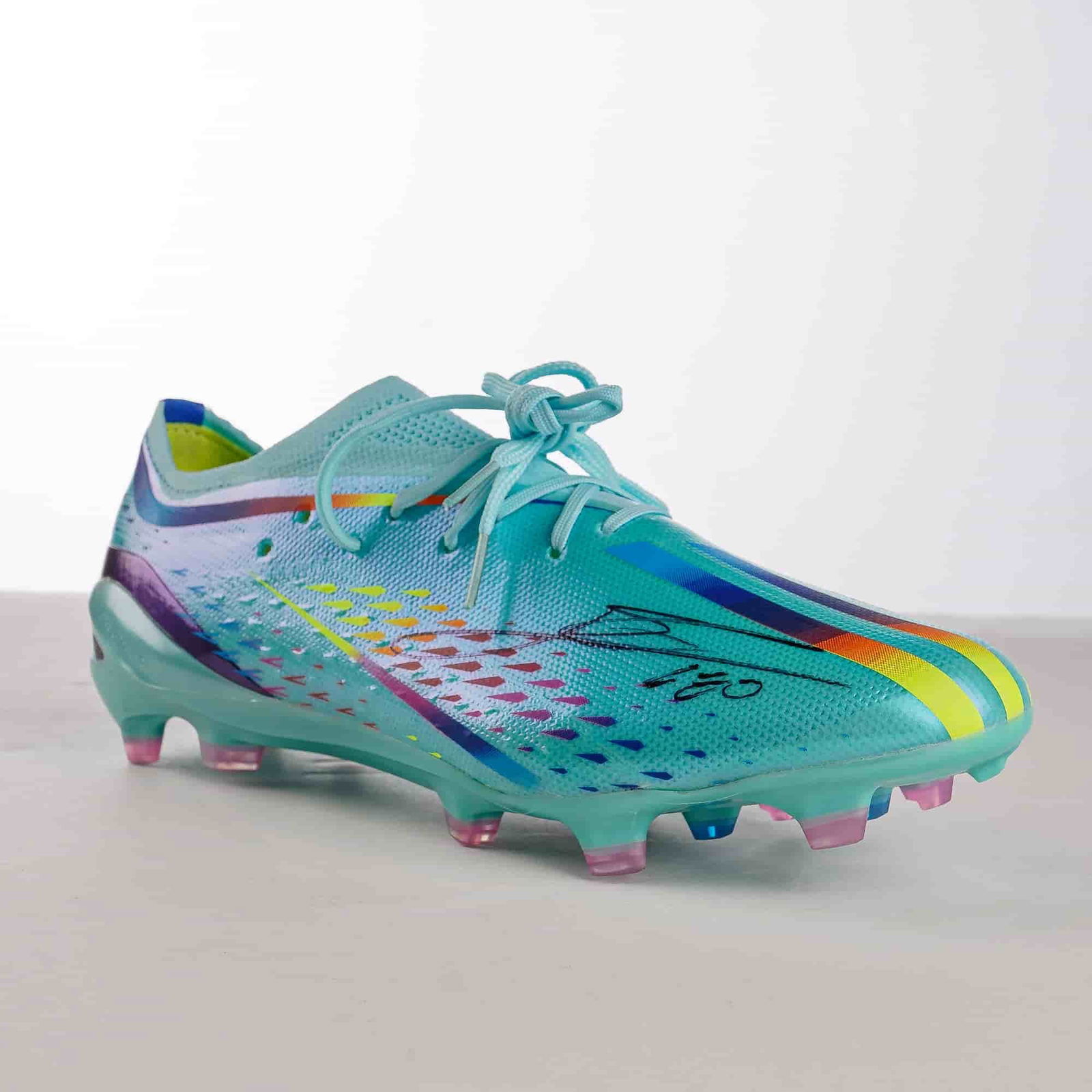 Lionel Messi Signed Adidas X Speedportal.1 Al Rihla Boot w/ COA: Adidas X Speedportal.1 Al Rihla edition soccer boot officially signed by Lionel Messi. The boot features a light blue synthetic upper with multi-colored graphic accents. The construction includes a
