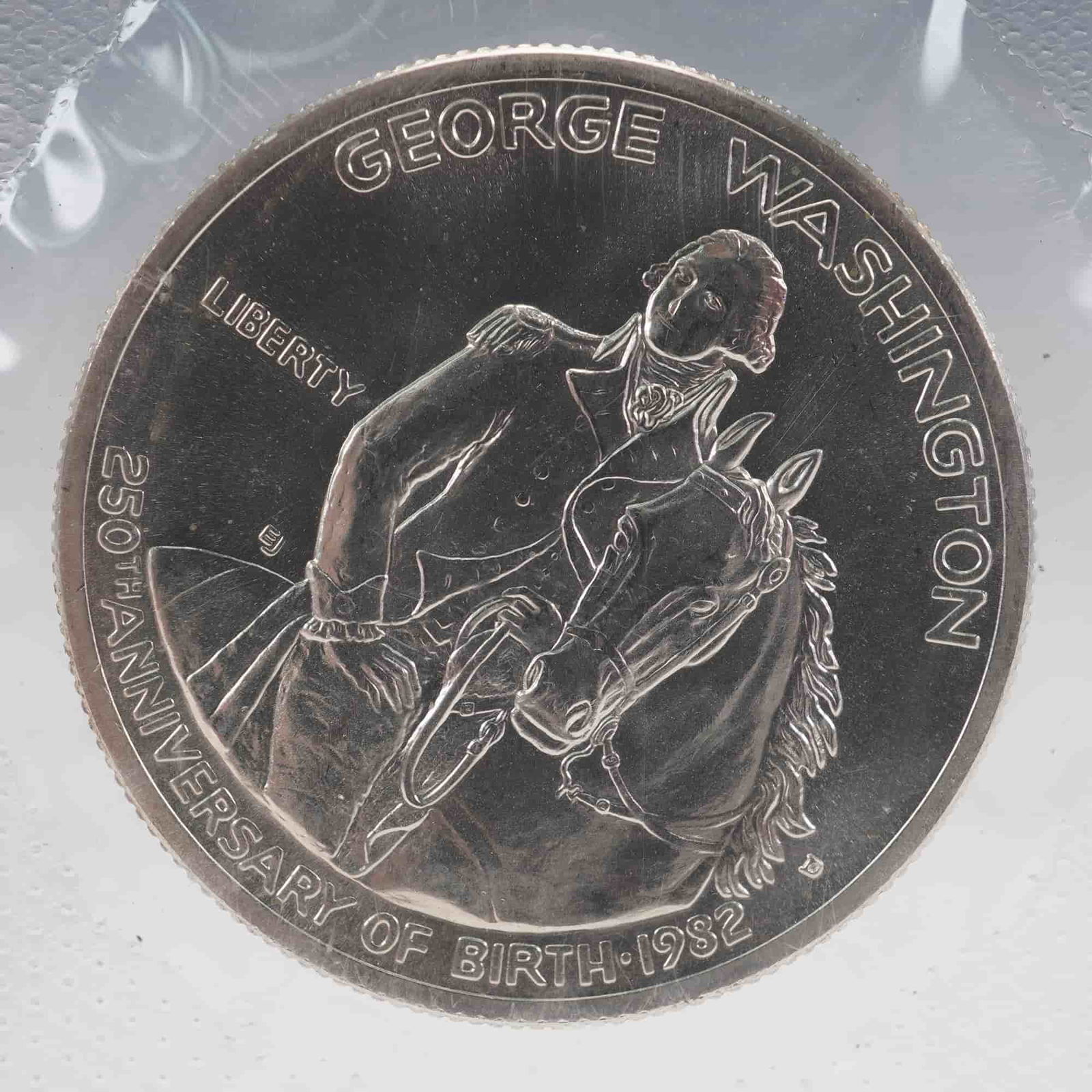1732-1982-D George Washington Commemorative Silver Half Dollar: United States Mint 1732-1982-D George Washington commemorative silver half dollar, struck to mark the 250th anniversary of Washington's birth. This uncirculated coin is presented in its original U.S.