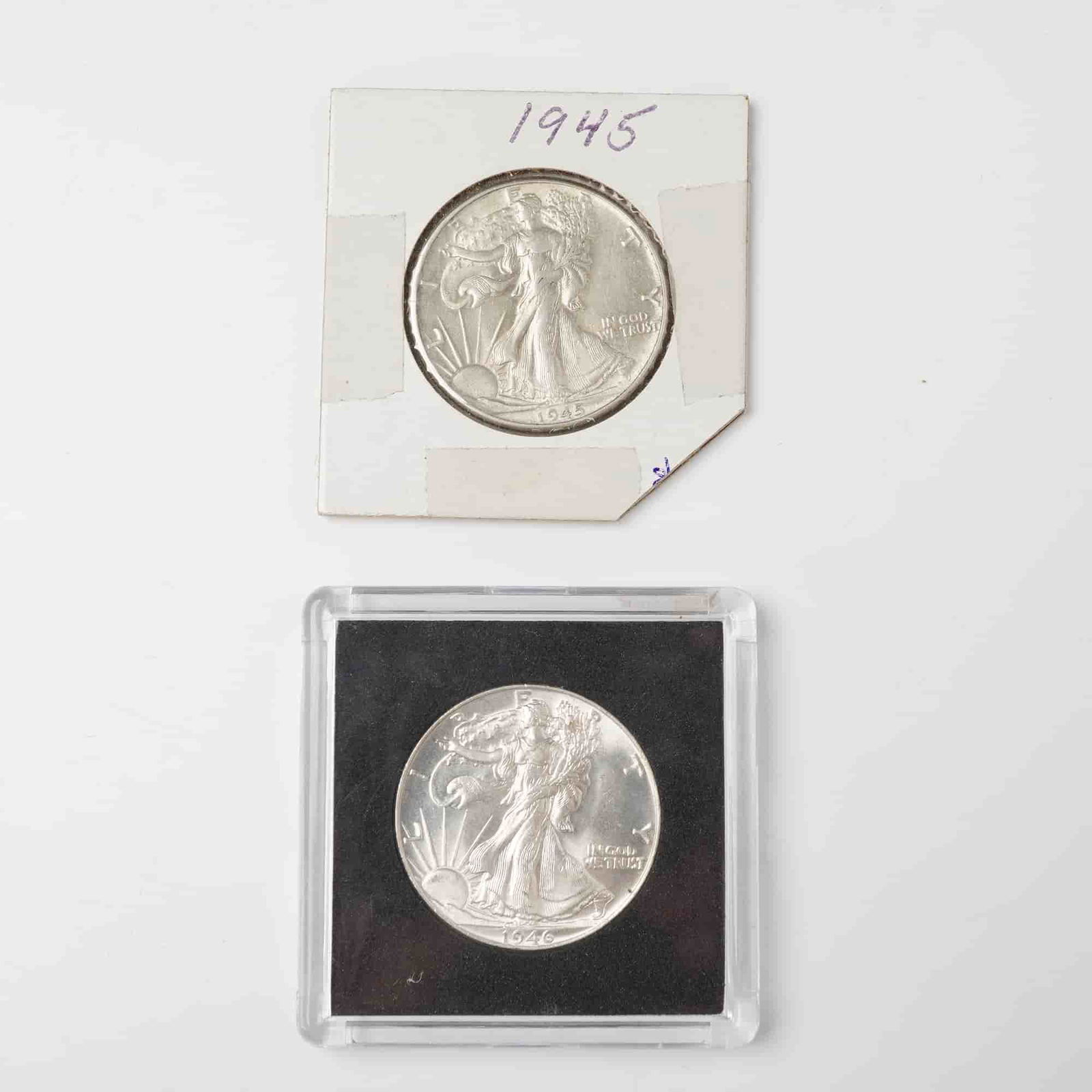 2pc 1945 to 1946 Walking Liberty Silver Half Dollars: On the obverse a full-length Liberty striding toward the rising sun with the inscriptions LIBERTY and IN GOD WE TRUST, and on the reverse an eagle perched on a rock with the inscriptions UNITED
