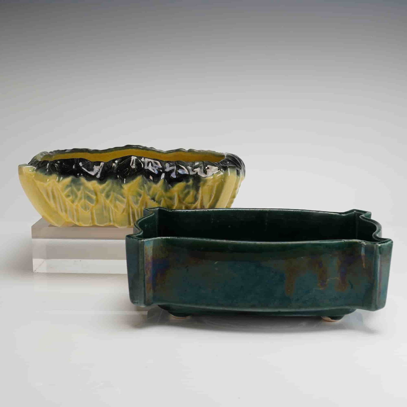 Two Mid-Century American Art Pottery Planters by McCoy and UPCO: Two American art pottery planters, comprising one piece by McCoy and one piece by UPCO (Upper Peninsula Ceramic Company). The collection includes a McCoy oval planter bowl featuring a stylized cabbage