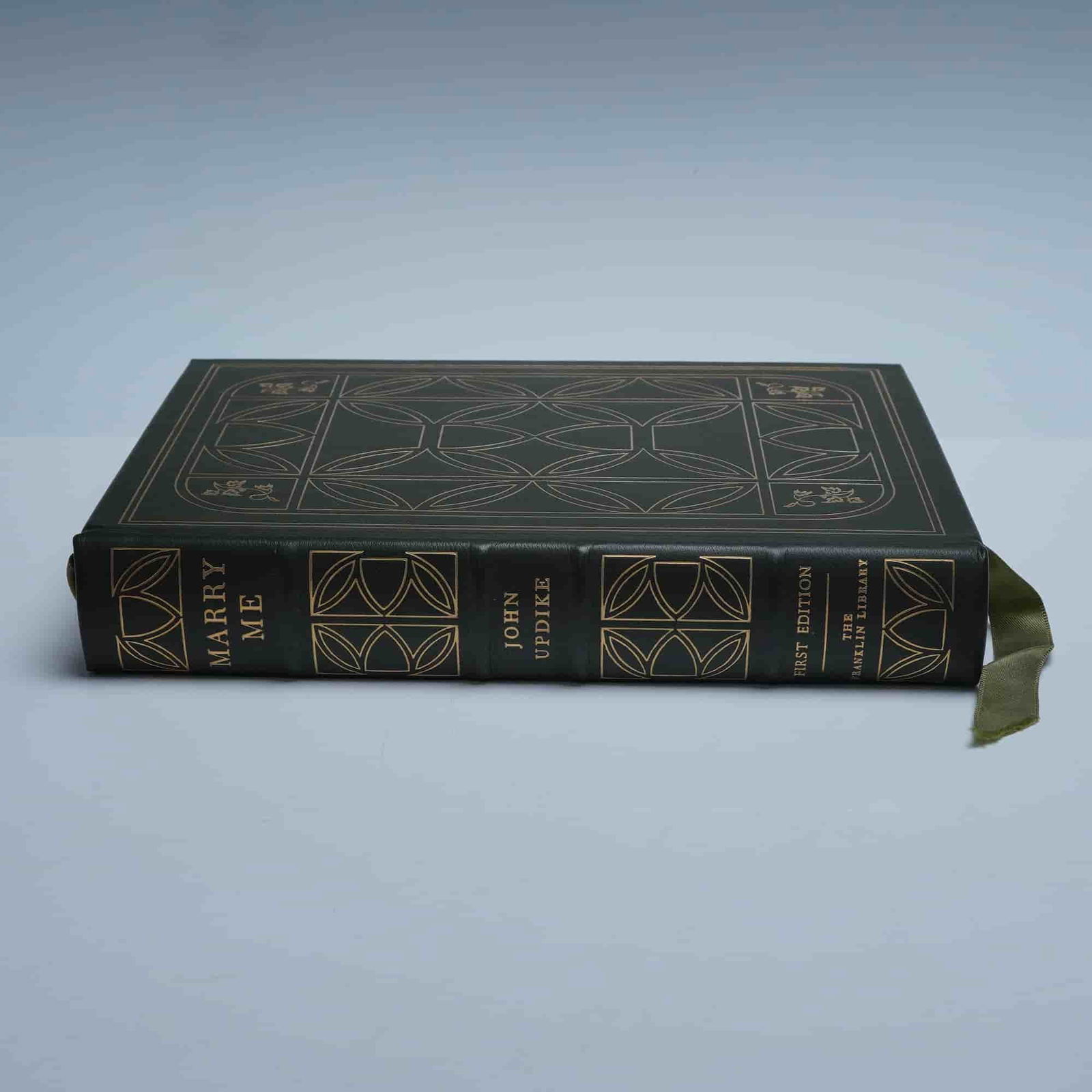 John Updike Franklin Library Hardcopy Book Marry Me 1976: Franklin Library First Edition Society printing of Marry Me by John Updike, privately published in 1976 at Franklin Center, Pennsylvania. This collector's edition is bound in dark green leather with