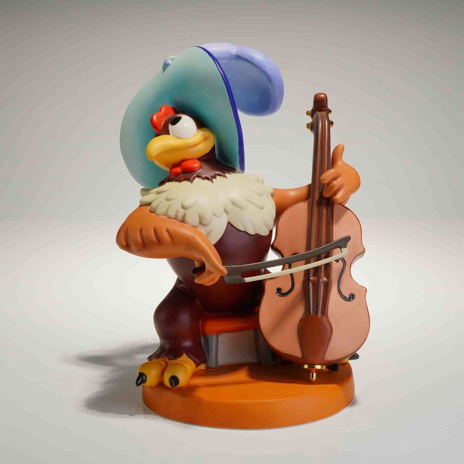 Walt Disney Classics Collection Clara Cluck Symphony Hour Figurine w/ COA: A Walt Disney Classics Collection porcelain figurine, titled "Bravo Bravissimo," that depicts the Disney character Clara Cluck (the Chicken) from the 1942 short Symphony Hour. The character is rendere