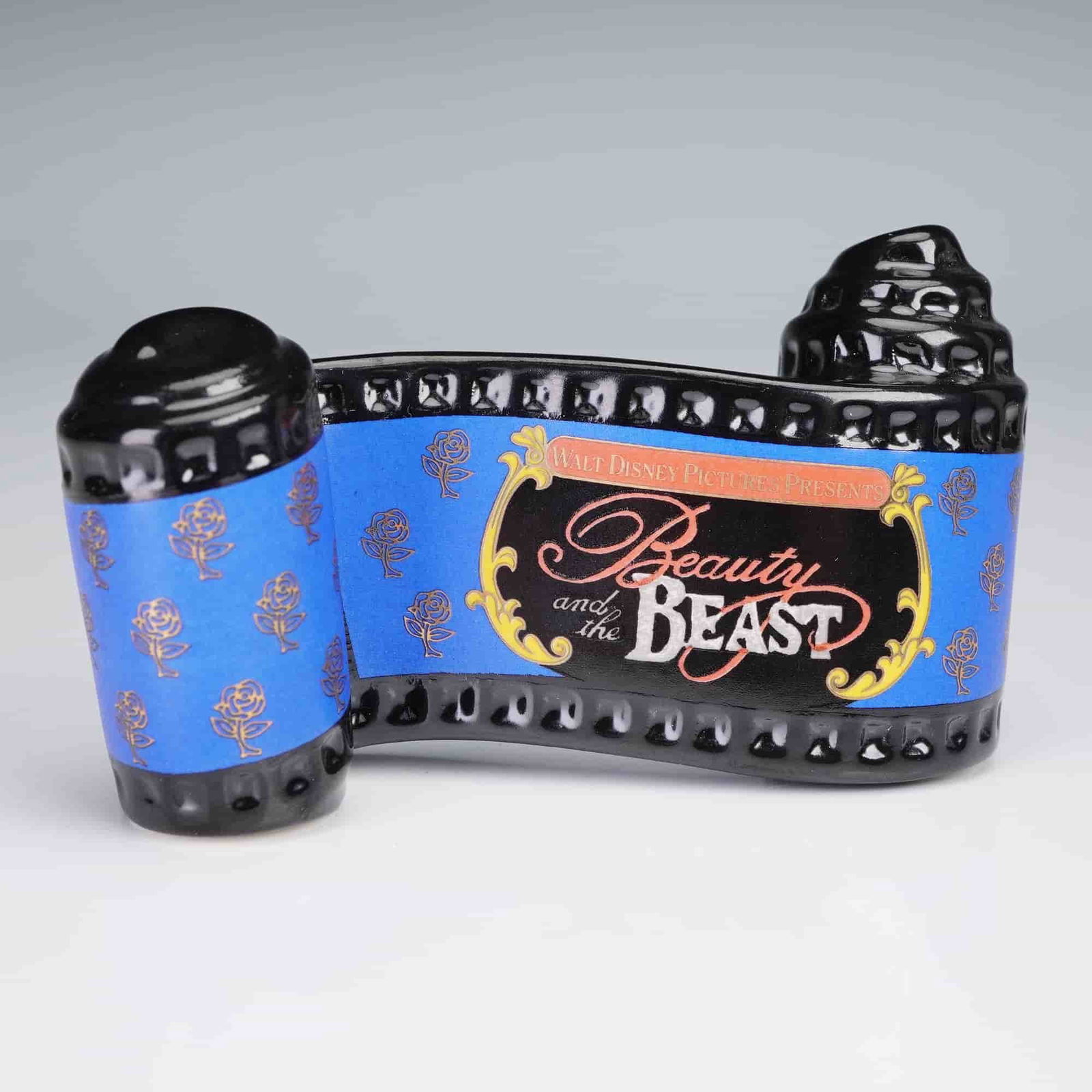 Walt Disney Classics Collection, Beauty and the Beast Opening Title: Walt Disney Classics Collection porcelain plaque depicting the opening title sequence from Beauty and the Beast, designed in the form of a scrolling film strip with black glossy finish and blue rose m