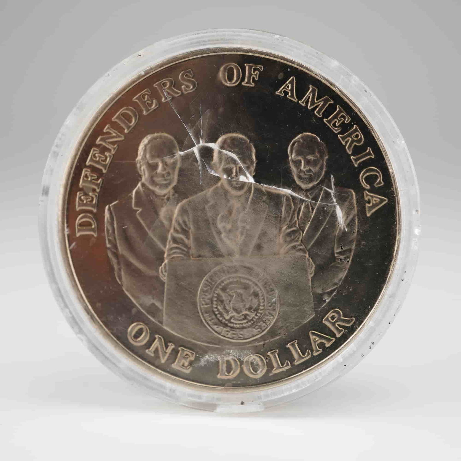 2004 $1 Northern Mariana Islands Defenders of America Coin: Featuring on the obverse the emblem of the Northern Mariana Islands with a circle of flowers and plants surrounding a sculpture and a star, with an eagle at the front and the year below. The reverse
