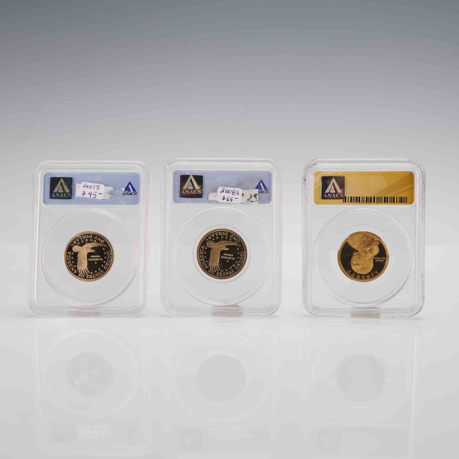 3pc 2007-S to 2008-S Sacagawea & 2009-S Native American Dollar ANACS Coins: This group includes three ANACS-certified proof dollars struck at the San Francisco Mint, each composed of a manganese-brass clad alloy weighing 8.1 grams with a composition of copper, zinc, manganese