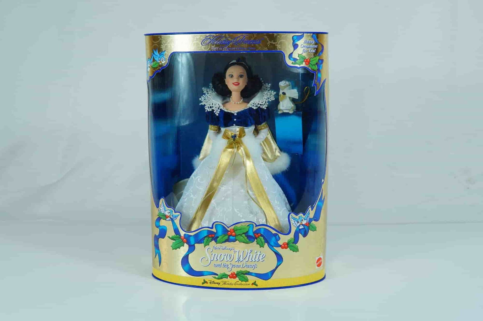Mattel Disney Holiday Princess Snow White Doll, 11.5-inch: Produced by Mattel, Inc., this vinyl fashion doll depicts the character Snow White and is part of the Disney Holiday Collection, serving as the third release in this Special Edition series. The doll f