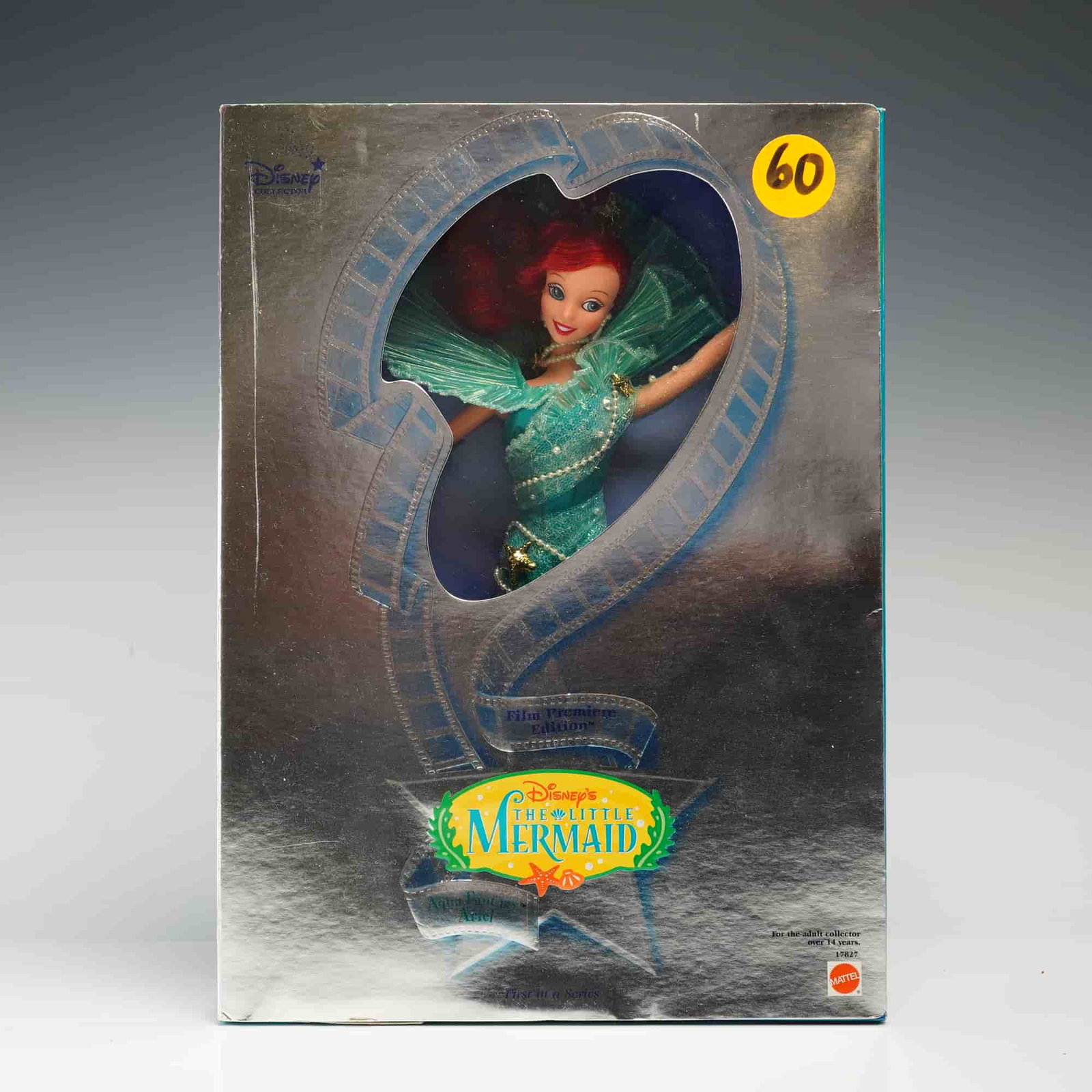 Mattel Disney's The Little Mermaid Aqua Fantasy Ariel Collector Doll, 11.5 Inches: Manufactured by Mattel, Inc., this vinyl fashion doll is the "Aqua Fantasy Ariel" from the Film Premiere Edition series. The doll features rooted bright red synthetic hair and fixed, painted blue eyes