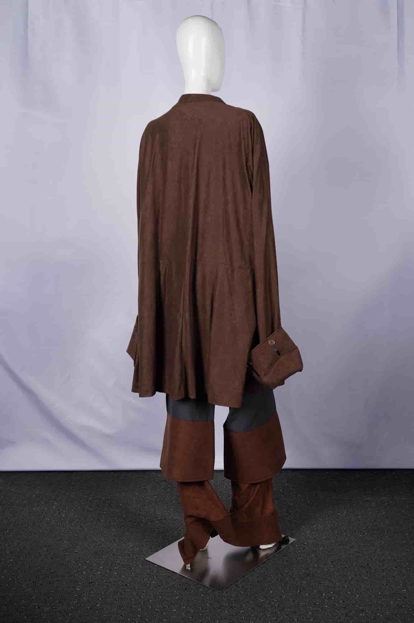 Disney shopping.com Brown Multi-Piece Costume Ensemble: A multi-piece costume ensemble by Disney shopping.com. Comprising a brown, knee-length coat with wide cuffs and three decorative brown buttons, a white satin-like undershirt, a blue-grey tunic, dark g