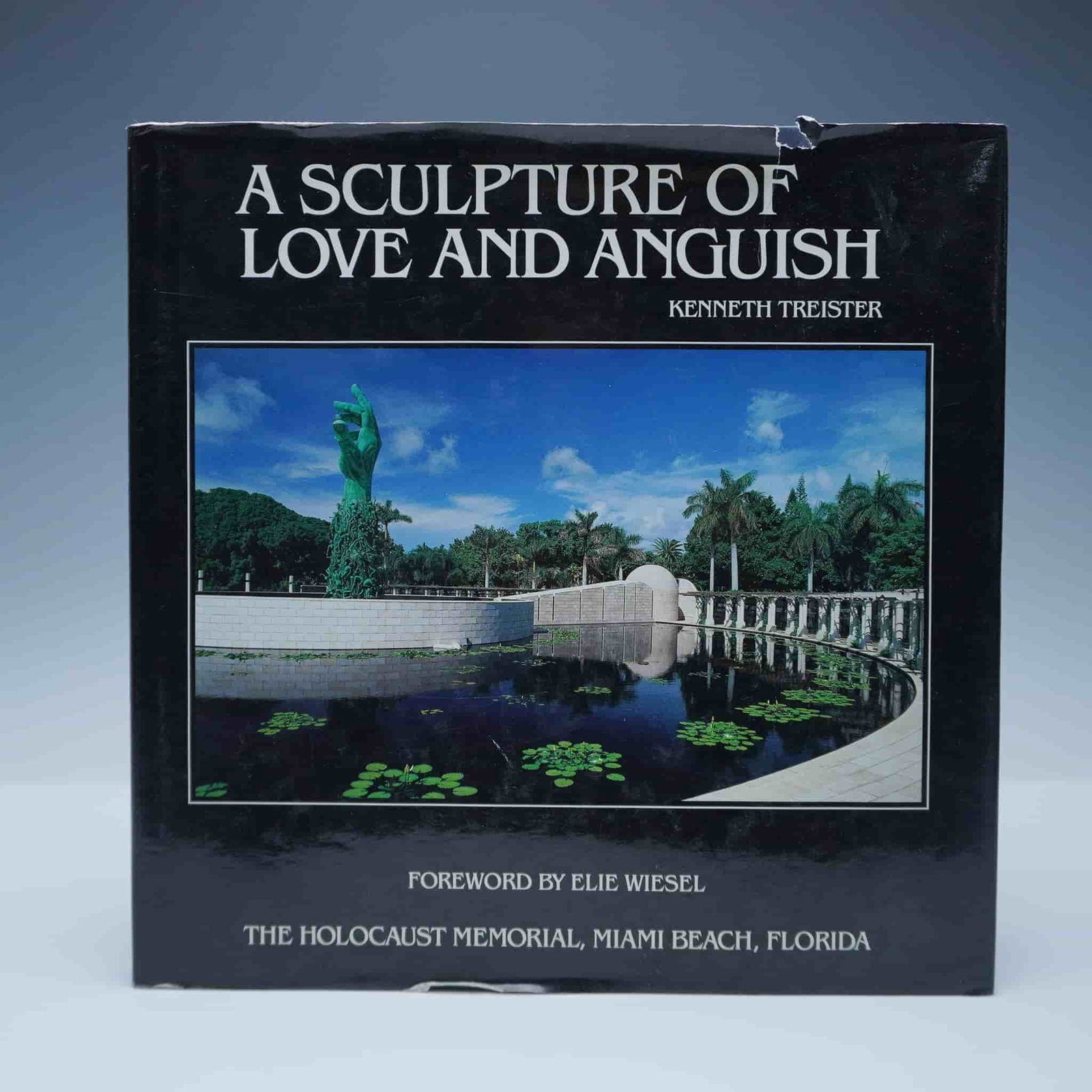 Kenneth Treister Hardcover Book, A Sculpture of Love and Anguish: New York: S.P.I. Books, 1993. A compelling visual and historical documentation of the Holocaust Memorial in Miami Beach, Florida, created by artist Kenneth Treister. Features a foreword by Elie