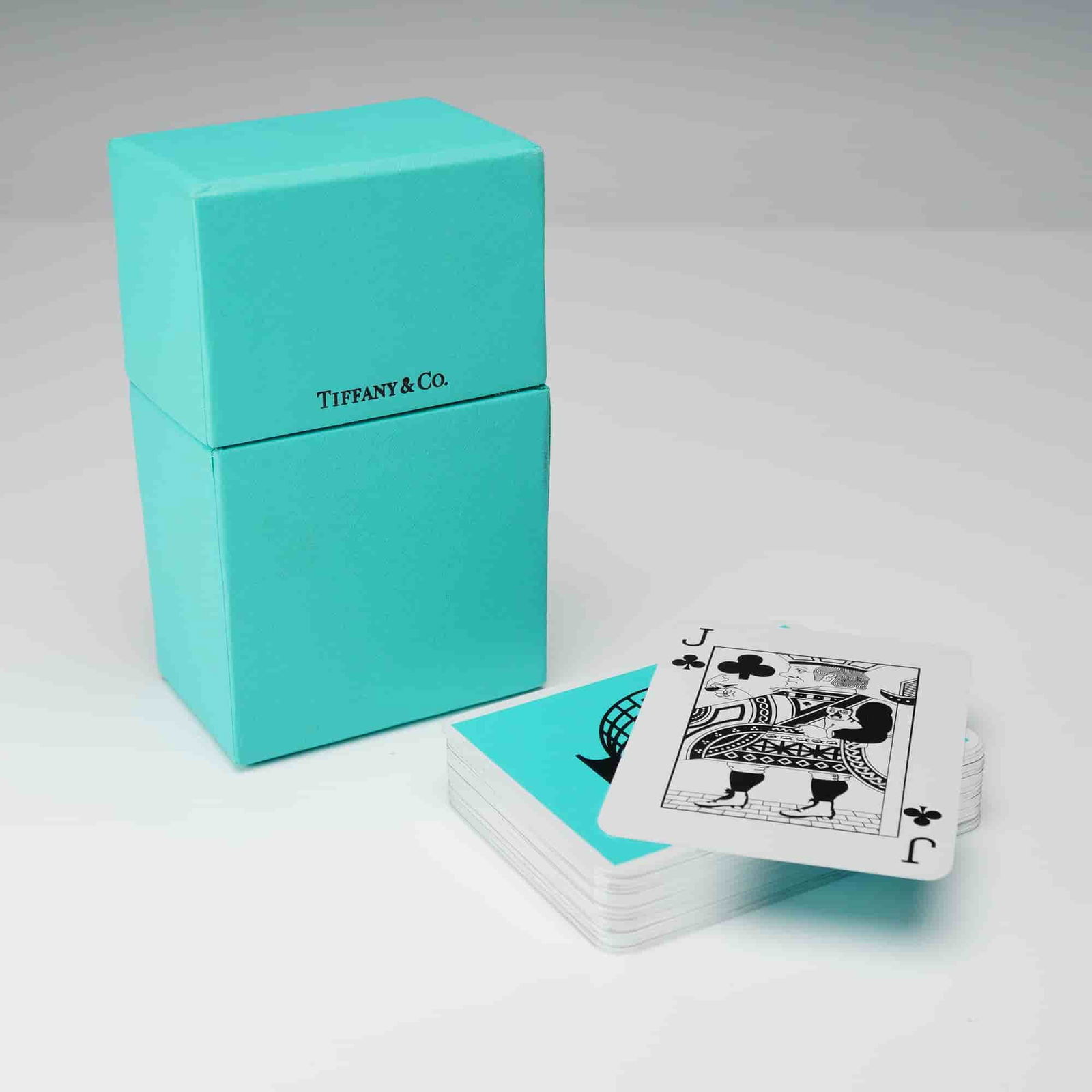 Tiffany & Co. Travel Two-Pack Playing Cards: A Tiffany & Co. Travel Two-Pack Playing Card Set. The set is housed within a signature Tiffany Blue-colored paperboard box, designed to split into two sections. The box prominently features "TIFFANY &