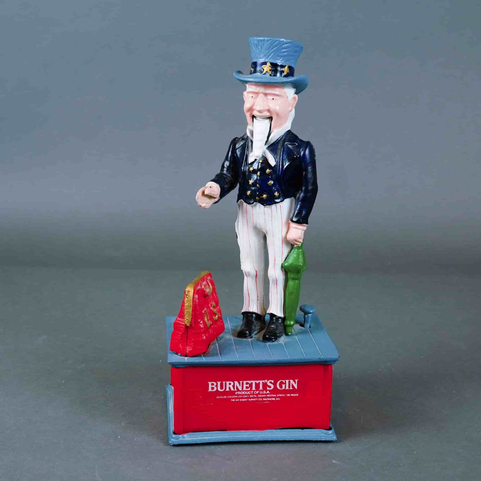 Burnett's Gin Mechanical Cast Iron Coin Bank: The set includes: two Franklin Half Dollars (90% silver, 12.5 g each), two Washington Quarters (90% silver, 6.25 g each), two Roosevelt Dimes (90% silver, 2.5 g each), two Jefferson Nickels (copper-ni