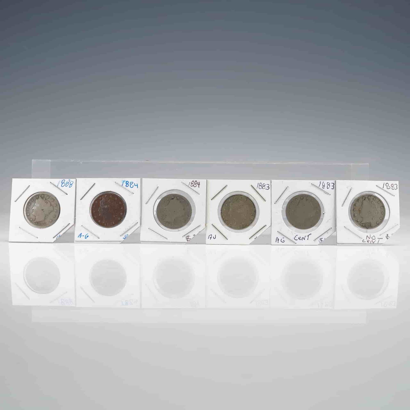 US 6pc Liberty V Nickels Collection 1883, 1884, and 1888: A collection of 6 US 5 Cents Liberty Nickels, also known as the "V" Nickel type, designed by Charles E. Barber. The lot includes examples spanning the years 1883, 1884, and 1888. The 1883 issue is rep