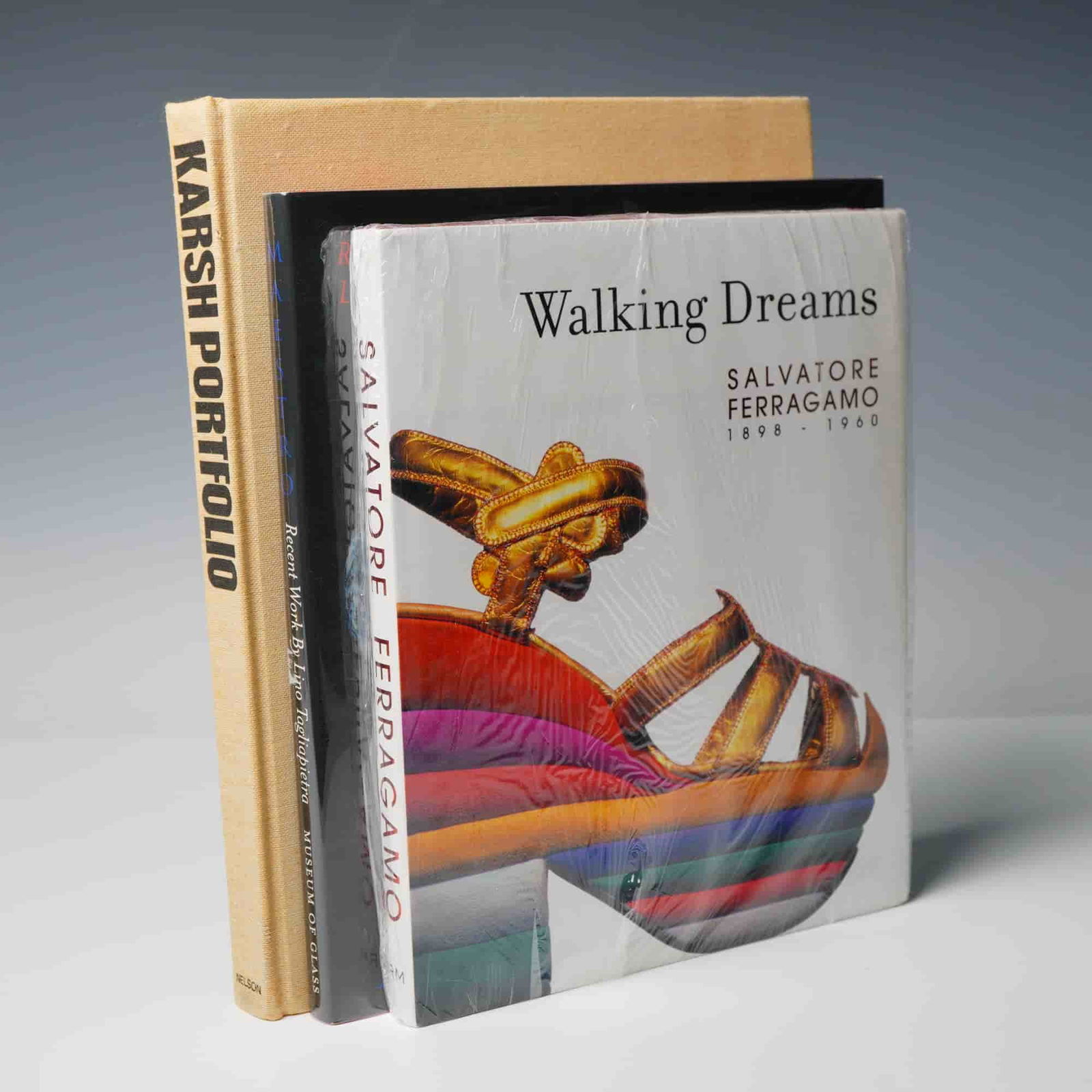 3 Art Hardcover Books, Walking Dreams, Maestro & Karsh Portfolio: Collection of three books. Includes "Walking Dreams: Salvatore Ferragamo 1898-1960" by Mercedes Iturbe, a sealed illustrated book documenting the life and work of Italian shoe designer Salvatore