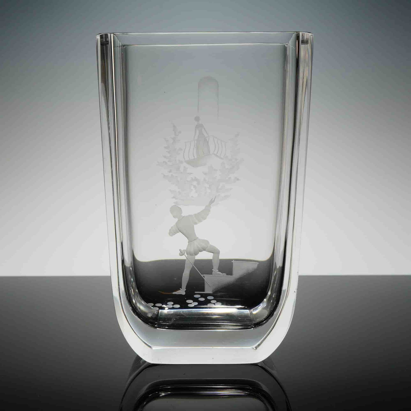 Orrefors Etched Crystal Romeo and Juliet Vase: The vase is made of heavy crystal and cut with the balcony scene of Romeo and Juliet. Base reiects Orrefors etched makers mark. Dimensions3.00"L x 5.00"W x 8.00"H