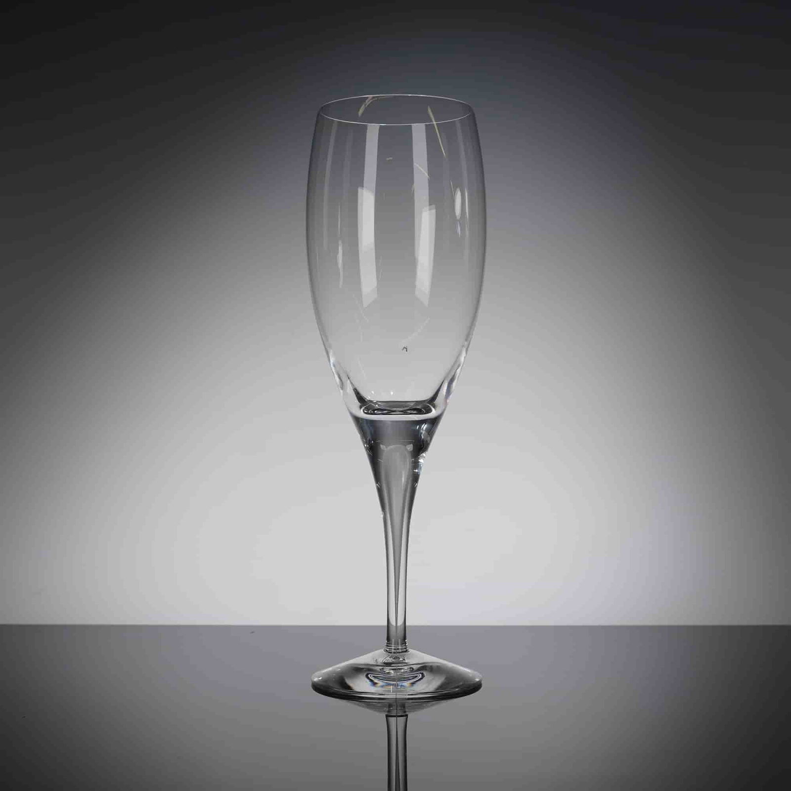 Orrefors Intermezzo Crystal Claret Wine Glass with Box: A single Orrefors Intermezzo Crystal claret wine glass, accompanied by its original black presentation box. The glass is crafted from clear, colorless crystal, featuring a modern, tall, and slender