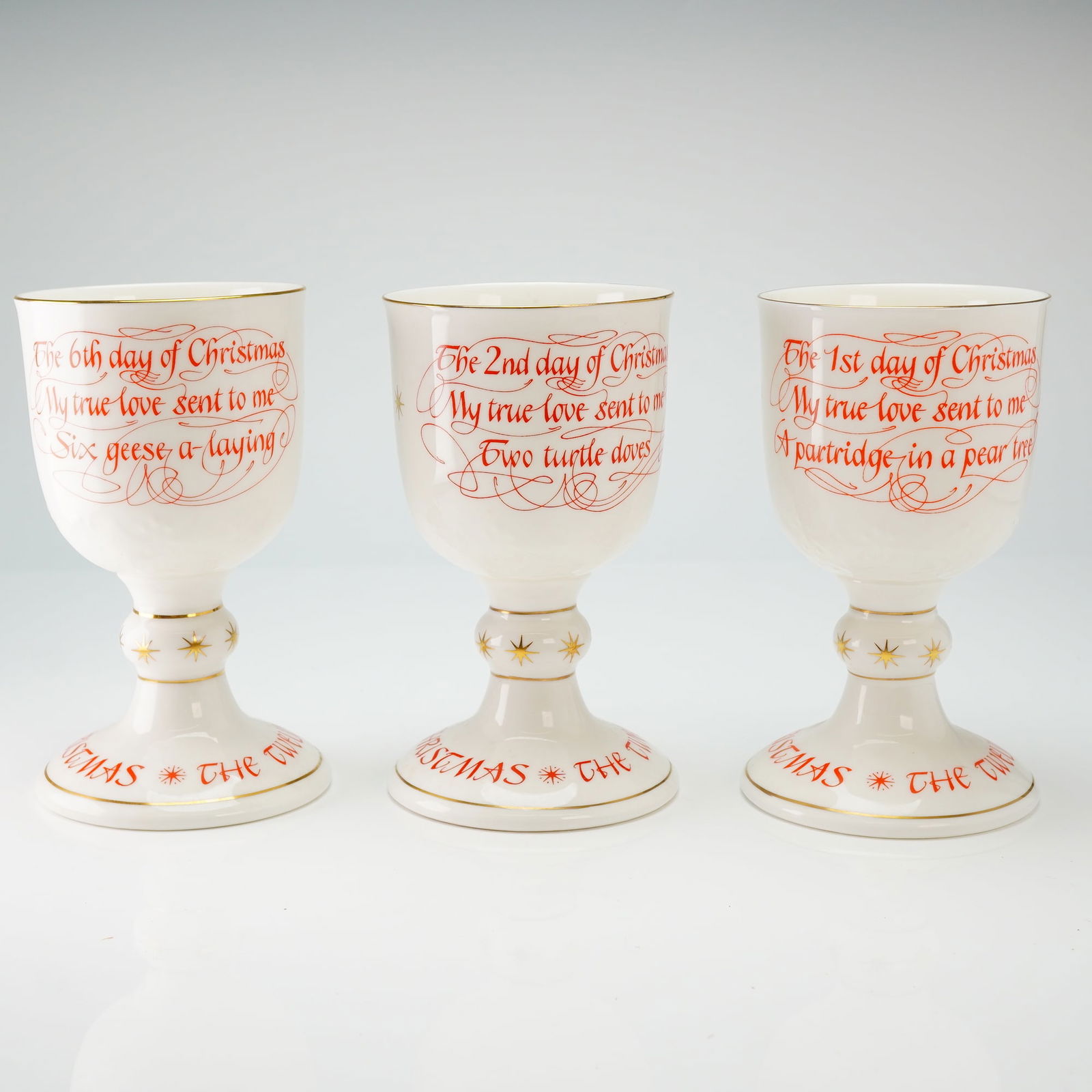 Trio of Royal Doulton The Twelve Days of Christmas Goblets: This group includes pieces representing the first, second, and sixth days of the traditional carol. Each goblet features a polychrome illustrative depiction of the respective verse on one side,