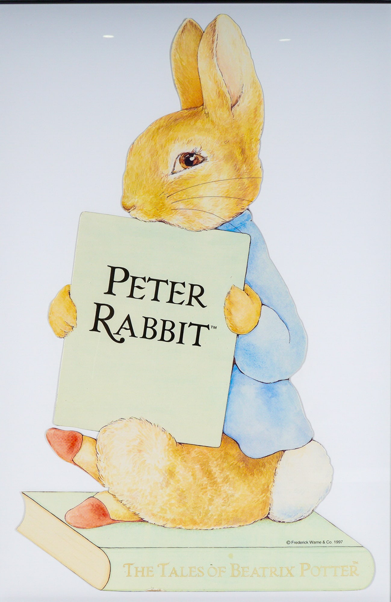 Framed Frederick Warne & Co. Beatrix Potter's Cutout, Peter Rabbit: A large, framed Peter Rabbit cutout thick print floating on a white mat, based on the iconic literary character and illustrations by Beatrix Potter. The cutout features the anthropomorphic rabbit, cla
