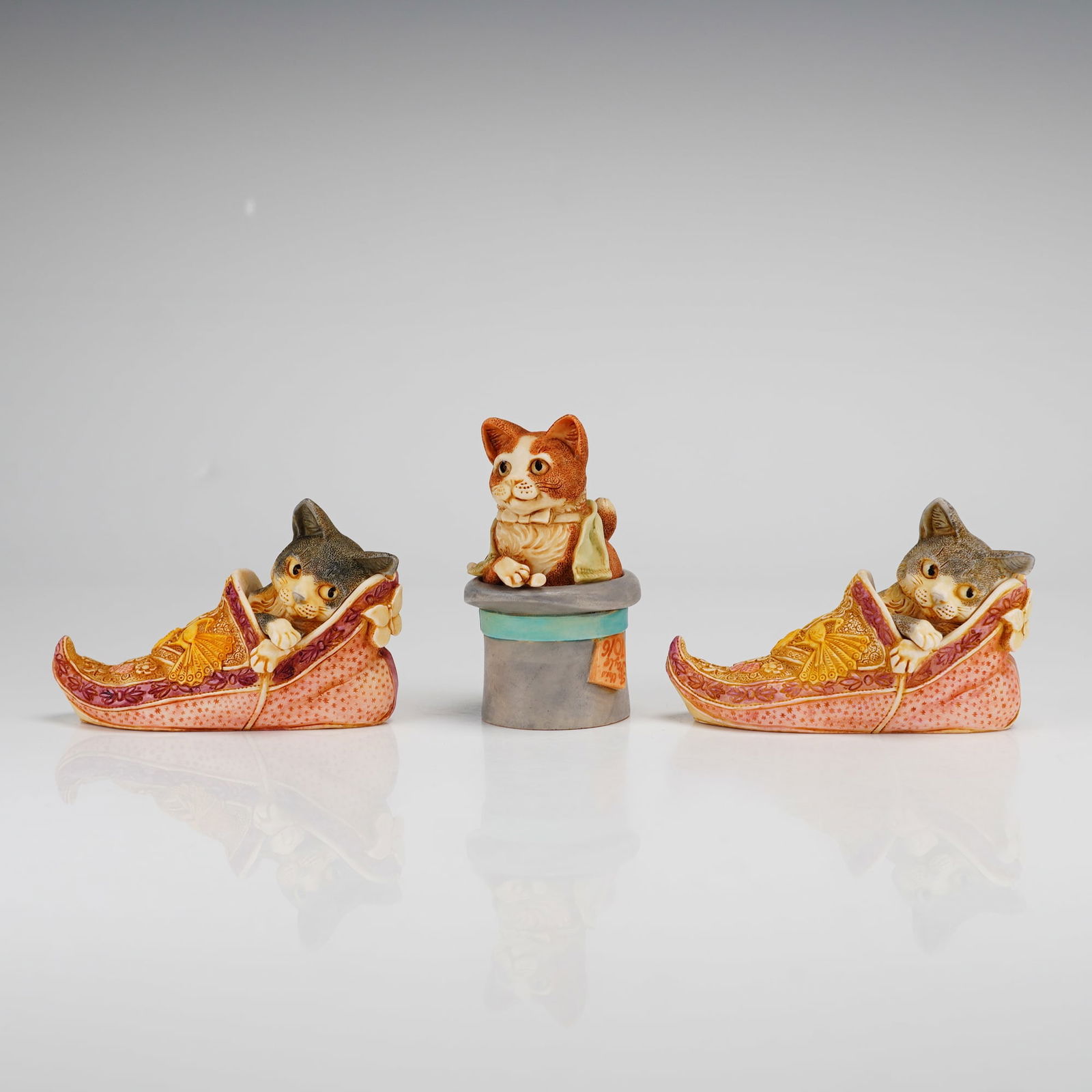 3pc Harmony Kingdom Trinket Boxes, Cherubini and Sharazade: This collection consists of three Harmony Kingdom Treasure Jests jewelry boxes, including one Cherubini and two Sharazade figurines. The Cherubini figurine features an orange and white tabby cat seate
