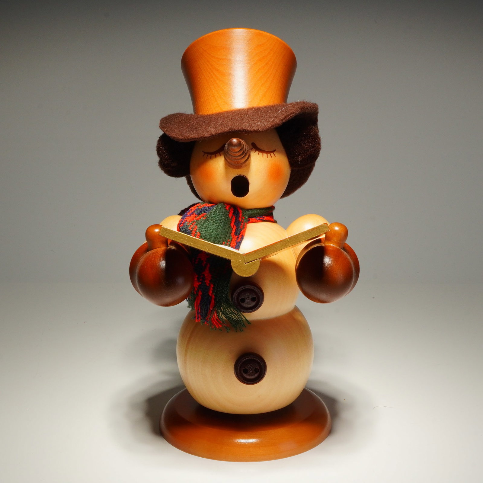Christian Ulbricht Natural Wood Incense Smoker, Snowman Caroler: A Christian Ulbricht wooden snowman caroler incense smoker crafted in the traditional German Erzgebirge folk art style. The figure is constructed from turned wood with a combination of natural and sta