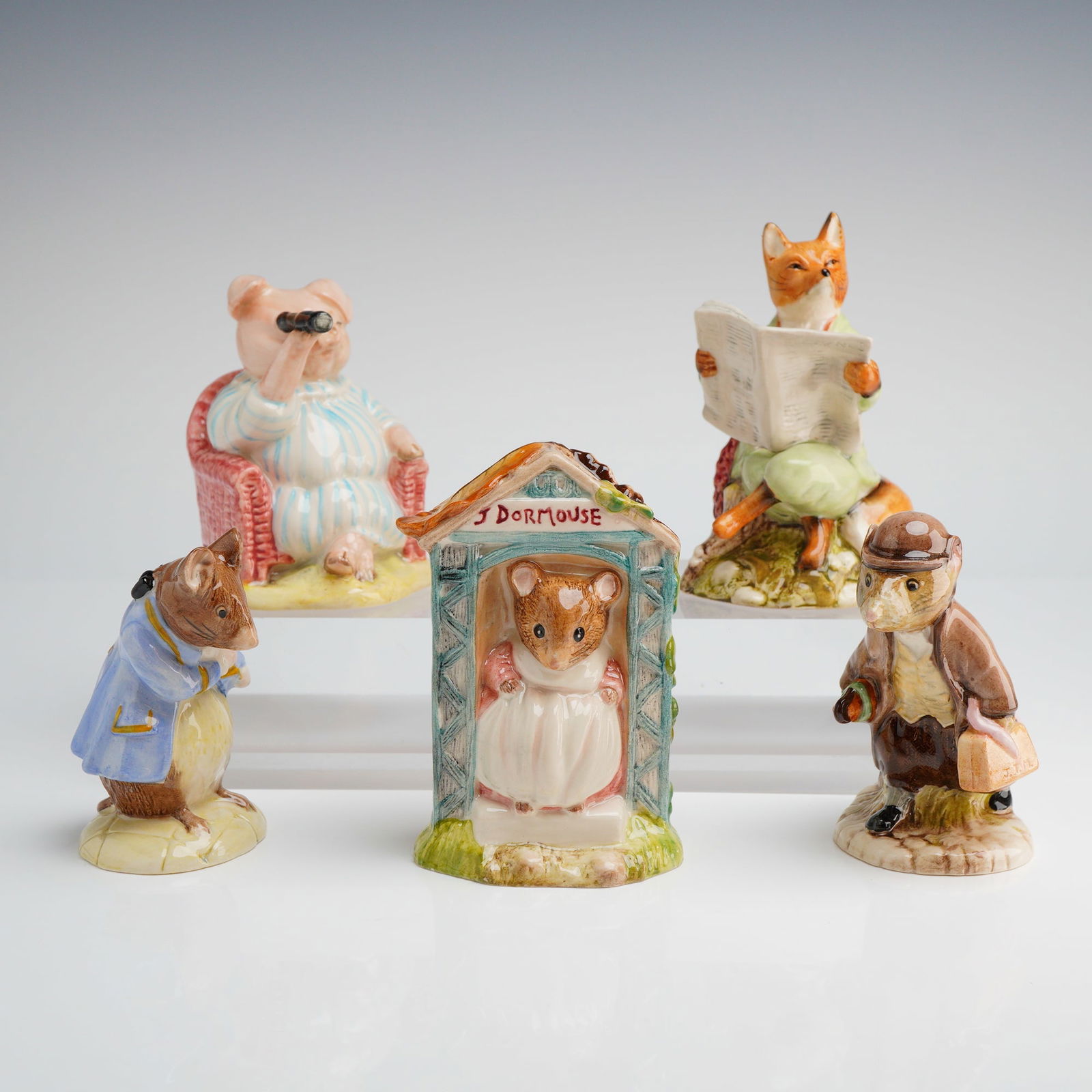 Collection of 5 Royal Albert Beatrix Potter Figurines: A collection of five glazed ceramic figurines manufactured by Royal Albert as part of the Beatrix Potter series. Each figure depicts an anthropomorphic animal character from the classic stories, decor