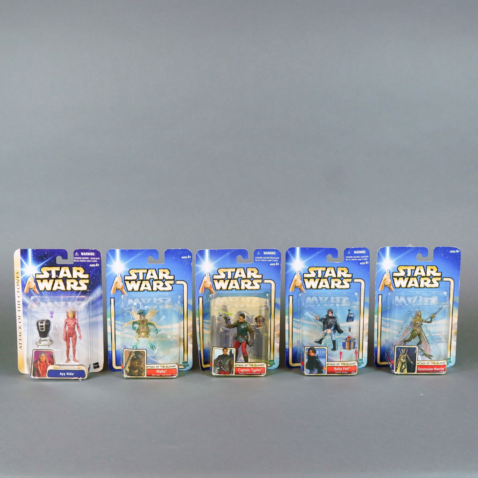 Hasbro Star Wars Attack of the Clones Saga Series Action Figures, 2002.: A collection of five action figures manufactured by Hasbro as part of the Star Wars: Attack of the Clones Saga series, circa 2002. These plastic figures are presented in their original factory-sealed
