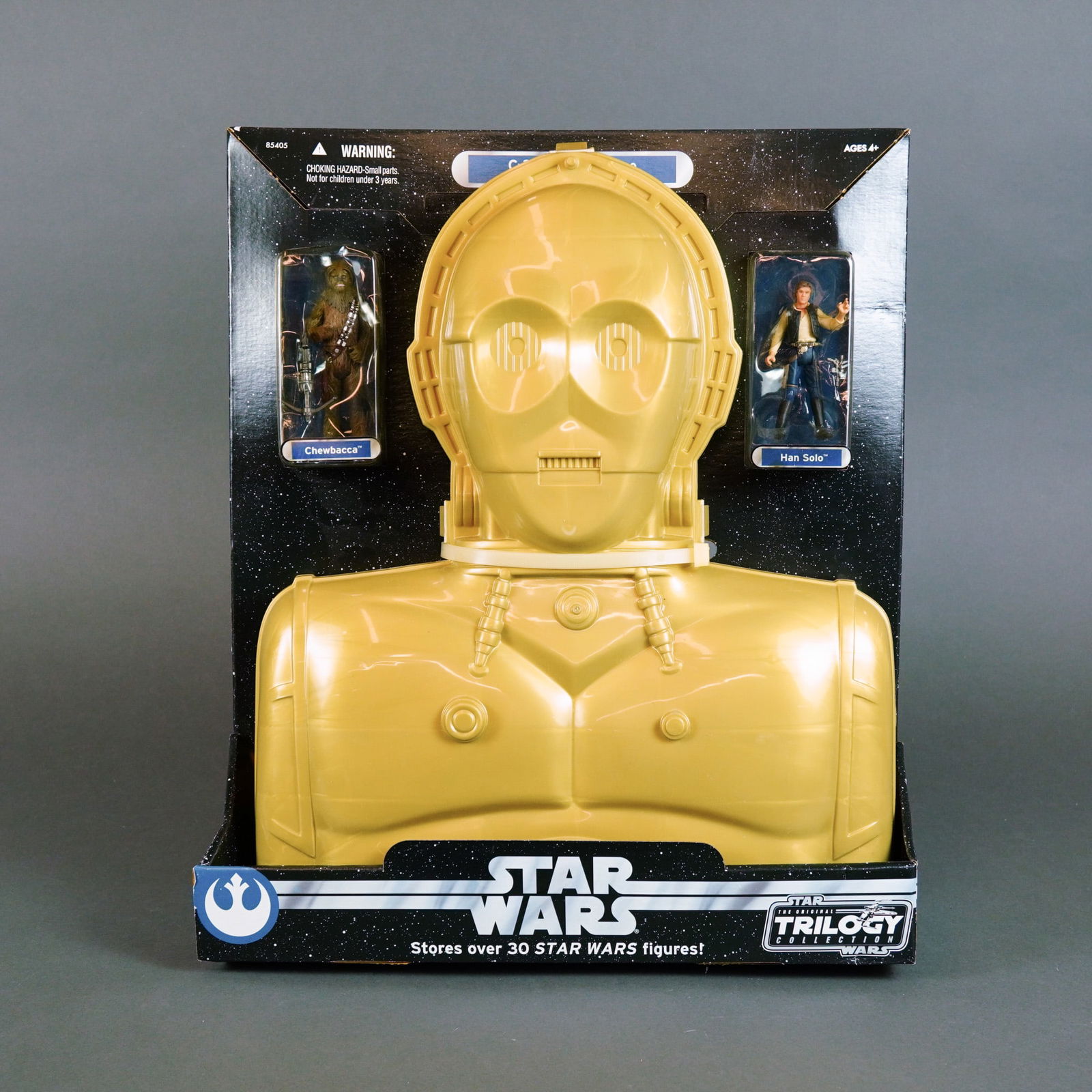 Hasbro Star Wars The Original Trilogy Collection C-3PO Carry Case with Figures, 2004.: Manufactured by Hasbro, this Star Wars C-3PO carry case is part of The Original Trilogy Collection (OTC) released in 2004. The storage case is constructed from gold-colored molded plastic and is desig
