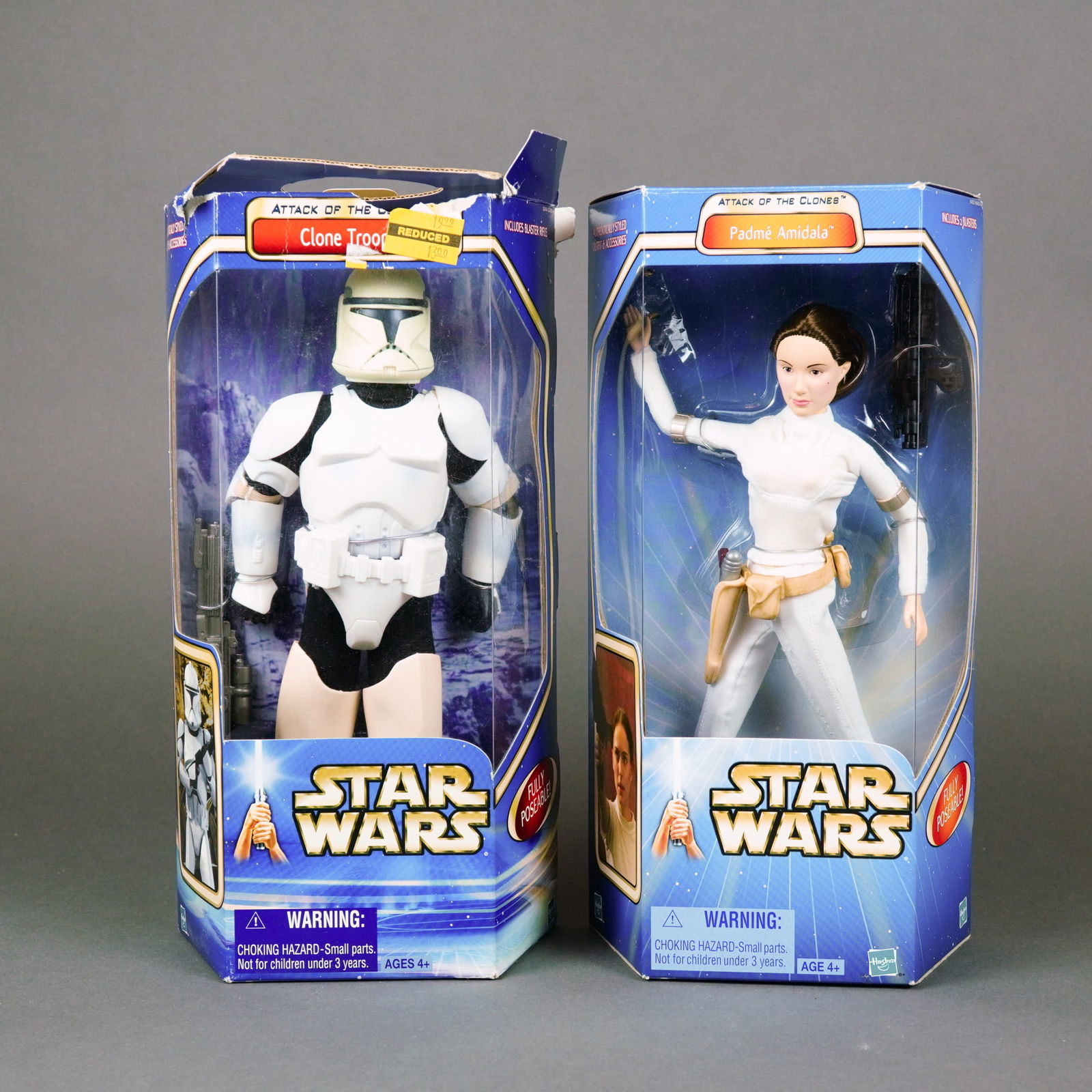 Hasbro Star Wars Attack of the Clones 12-inch Action Figures, 2002: Manufactured by Hasbro, this lot features a pair of 12-inch scale articulated action figures from the Star Wars: Episode II - Attack of the Clones collection. The figures are constructed of molded pla