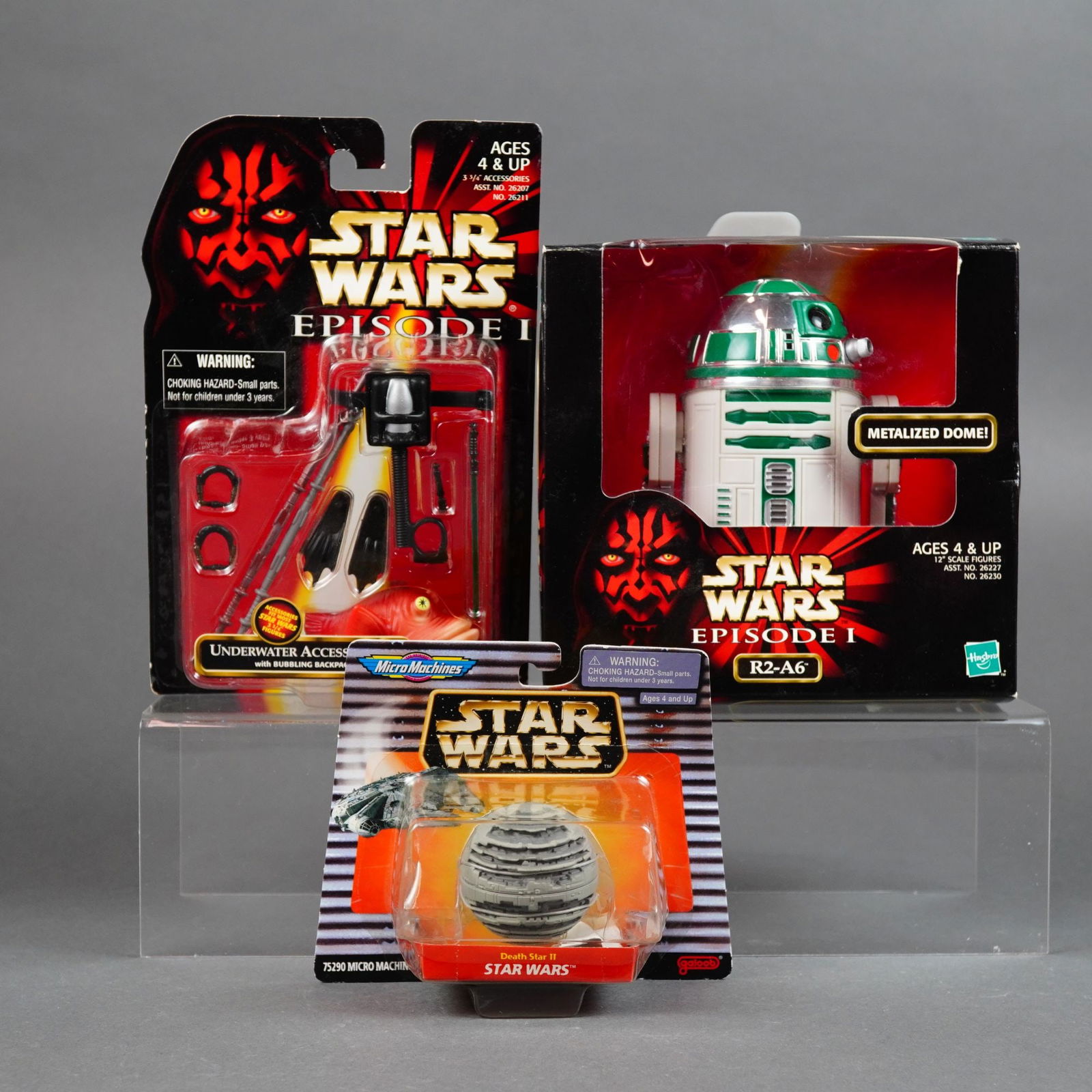 Hasbro and Galoob Three Star Wars Collectibles, 1997-1998: Manufactured by Hasbro and Galoob, this lot features three Star Wars themed collectibles from the late 1990s. The set includes a Hasbro Star Wars: Episode I Underwater Access Accessory Set (1998) for