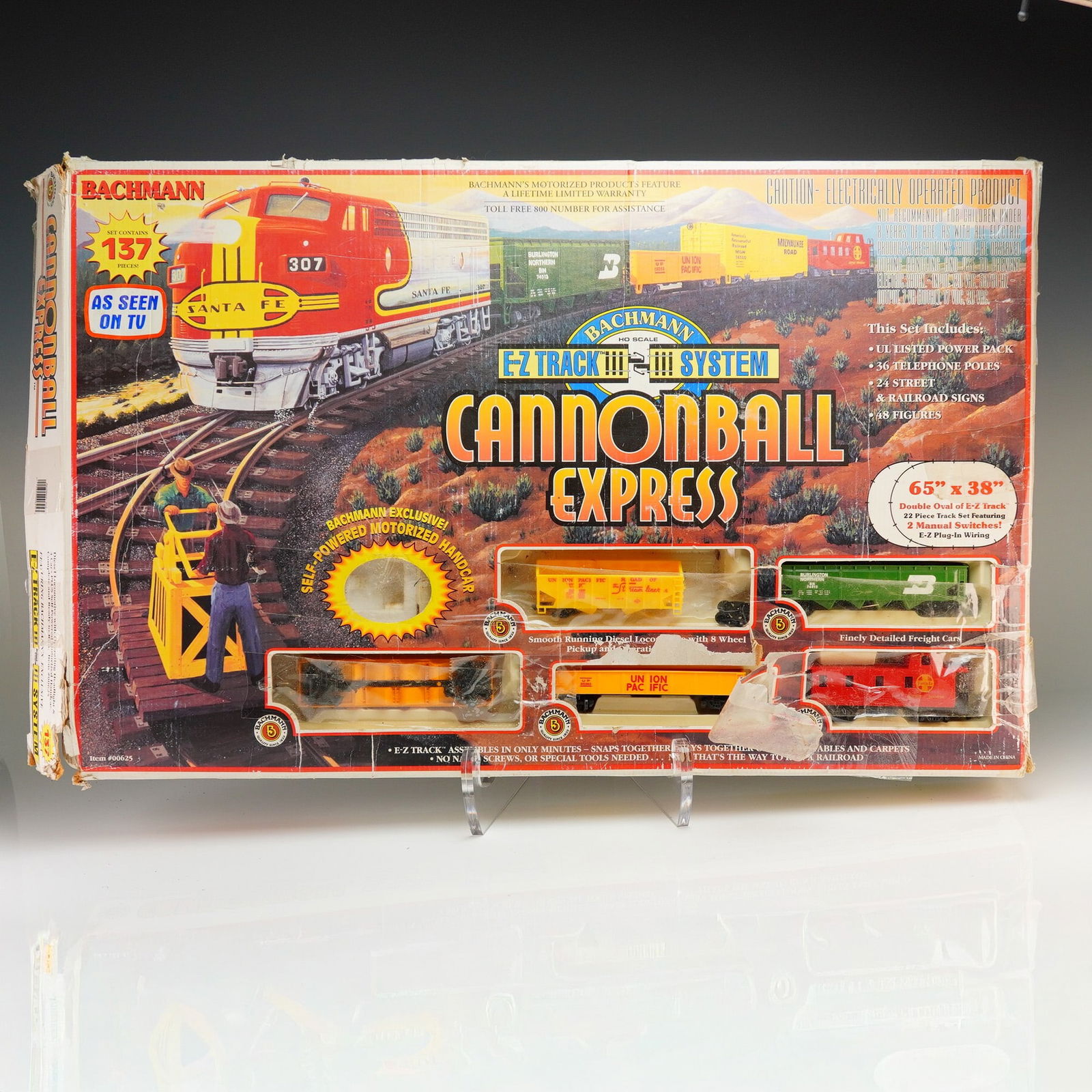 Bachmann Cannonball Express HO Scale Electric Train Set Item 00625: A Bachmann HO scale train set titled Cannonball Express, item number 00625. This 137-piece set features a Santa Fe diesel locomotive and a collection of freight cars, including a green Burlington