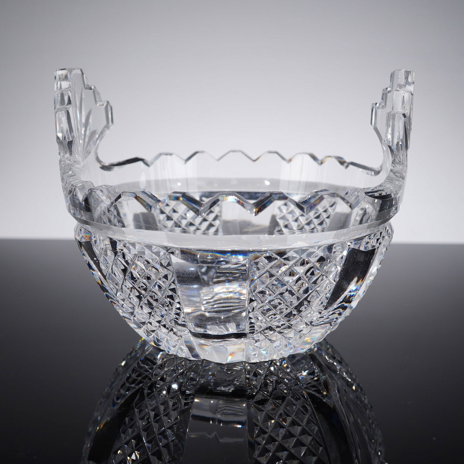 Waterford Alana Pattern Handled Crystal Sugar Bowl: A fine lead crystal handled open bowl, traditionally used as a sugar bowl or sweetmeat dish, manufactured by Waterford in the classic Alana pattern. This recognizable Irish design features a dense fie