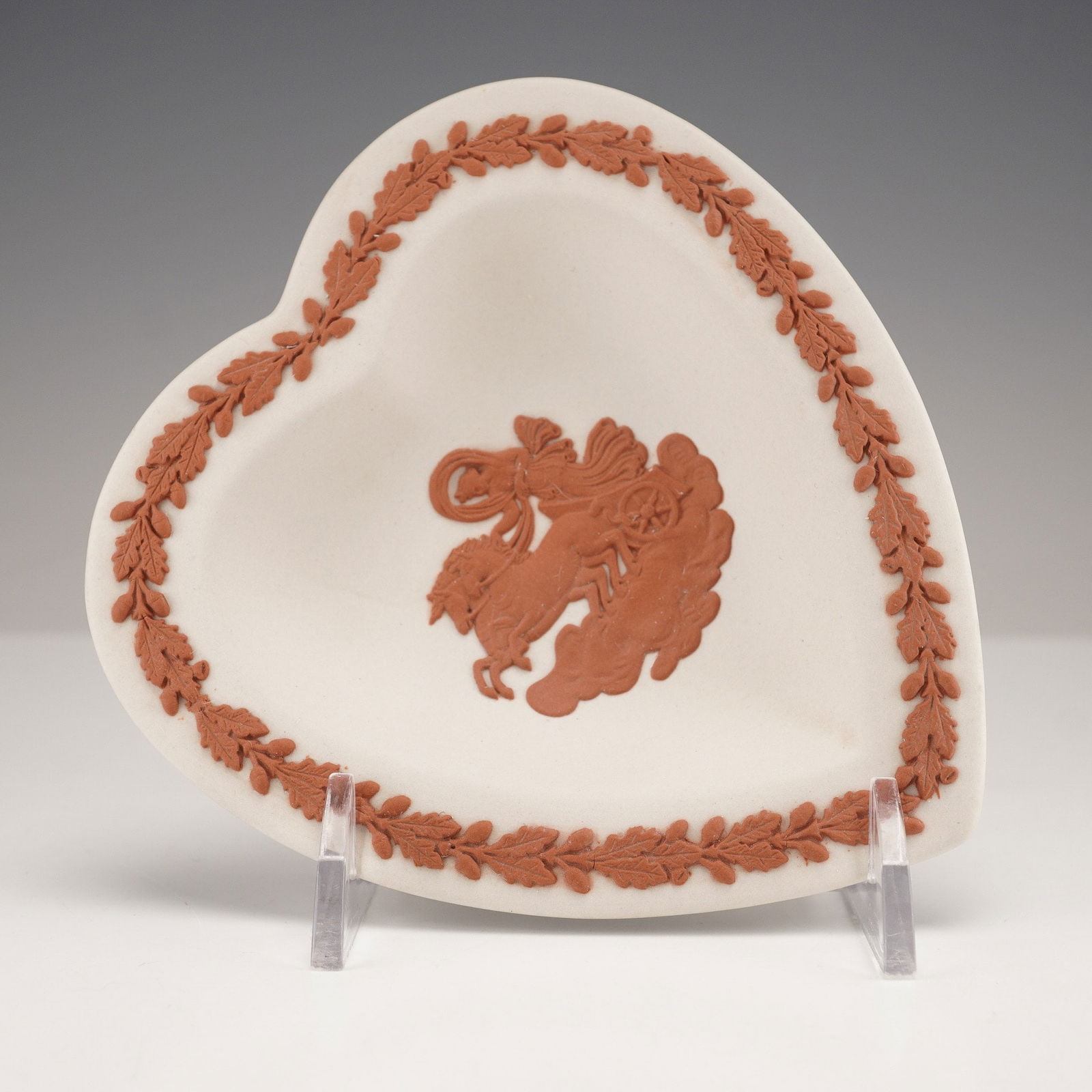 Wedgwood Jasperware Ceramic Heart-Shaped Dish from The Collectors Society: A Wedgwood Jasperware terracotta on white heart-shaped tray. This unglazed ceramic dish features neoclassical-style relief decoration. The interior displays a central raised motif of a classical figur