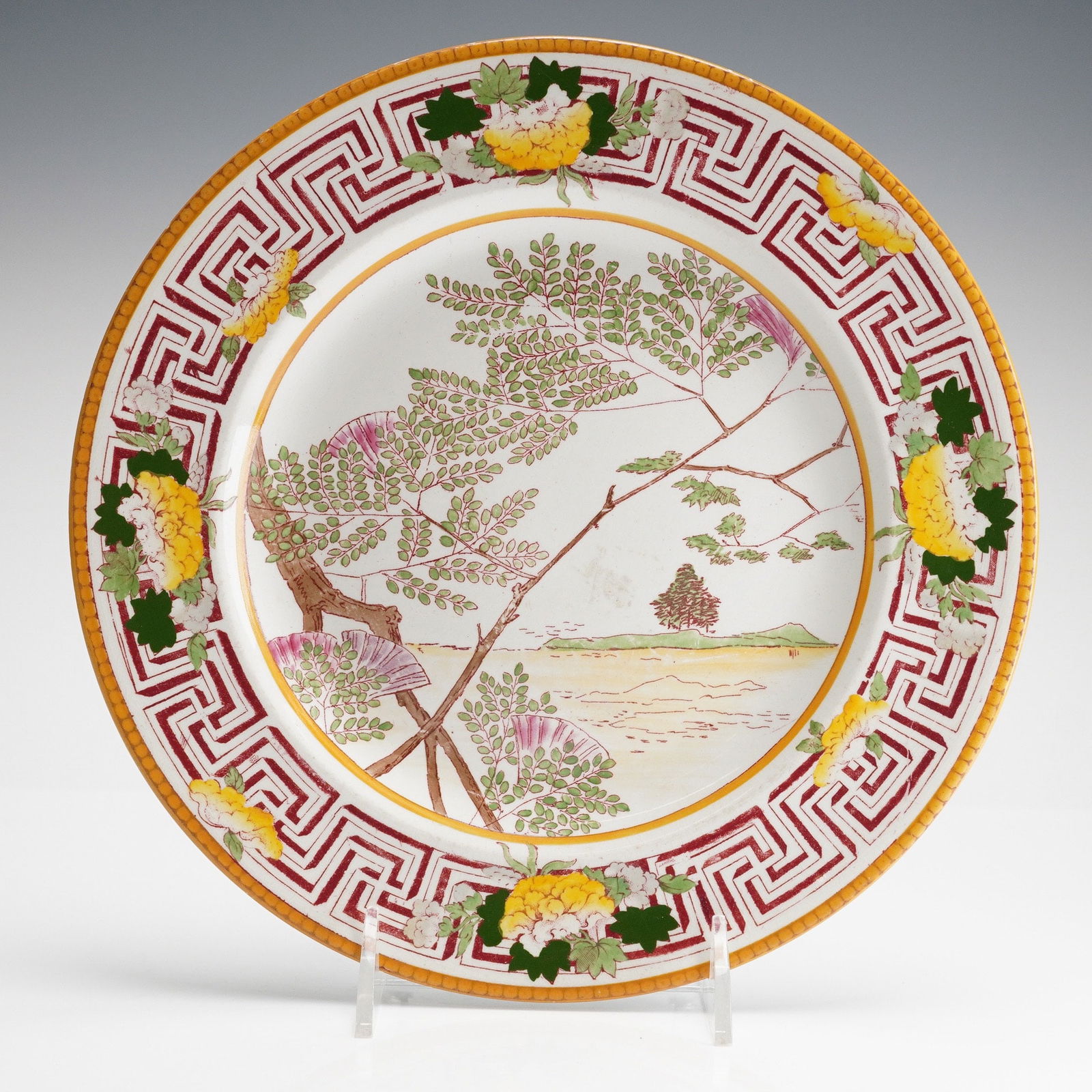 Wedgwood Queensware Japanese Landscape Motif Plate: This Wedgwood England Queensware Plate features a polychrome enamel decoration in a sophisticated Japanese Landscape style. The center well depicts a stylized tree with bright green foliage and pink b