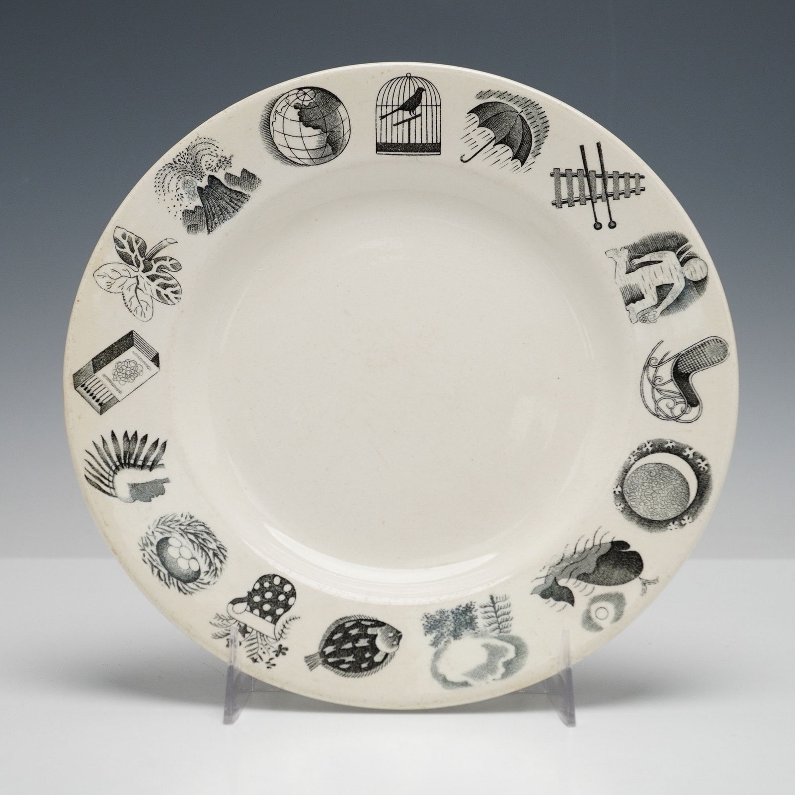 Wedgwood 'Alphabet' Ceramic Plate by Eric Ravilious: A Wedgwood 'Alphabet' plate, designed by Eric Ravilious. This circular, off-white ceramic plate features a series of sixteen distinct black and white pictorial vignettes arranged around its rim, inclu