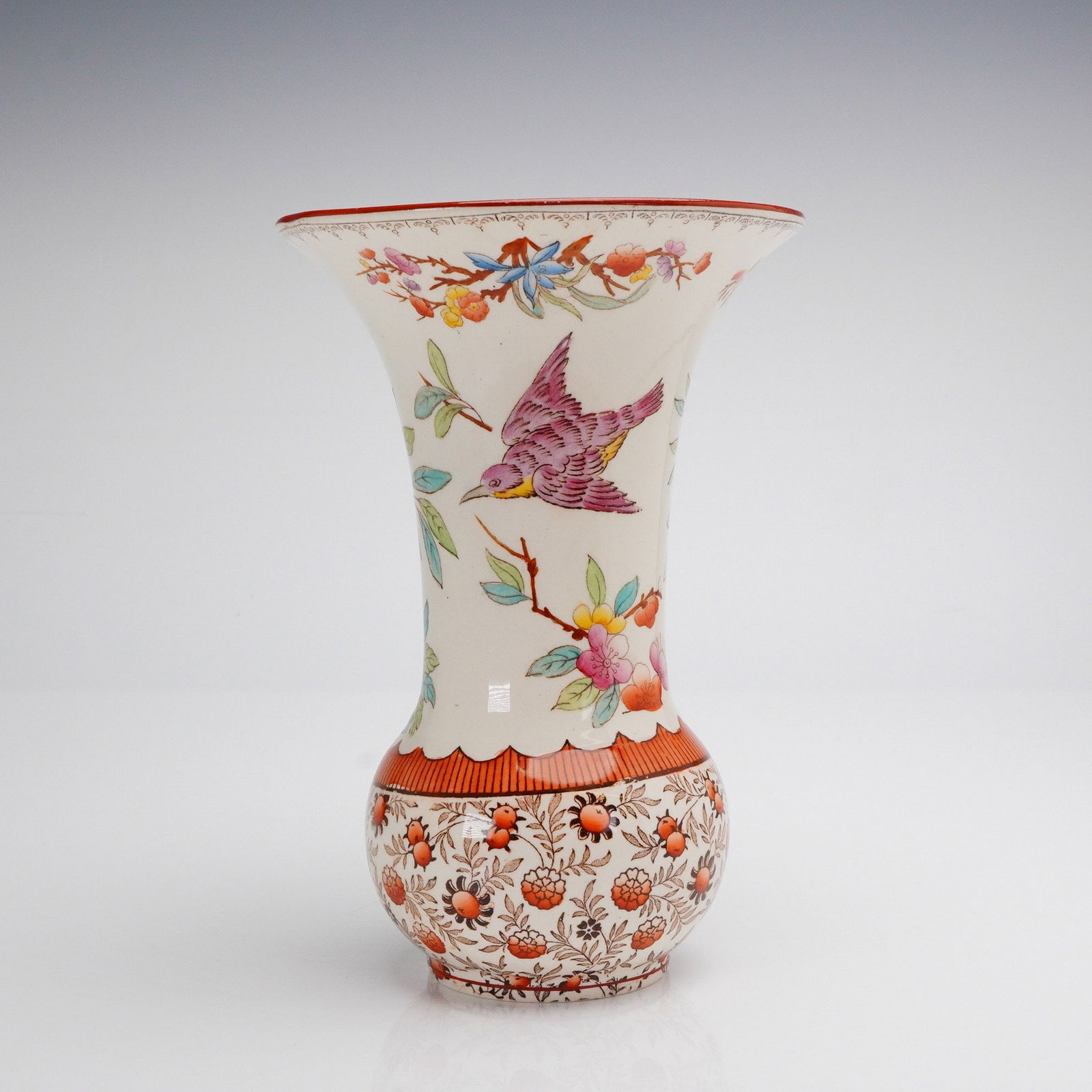 Wedgwood Earthenware Trumpet Vase, Imari Palette: A single glazed ceramic vase featuring a bulbous base and a dramatically flared, trumpet-shaped neck and rim. The object is decorated in a polychrome Oriental or Imari-inspired pattern, consistent wit