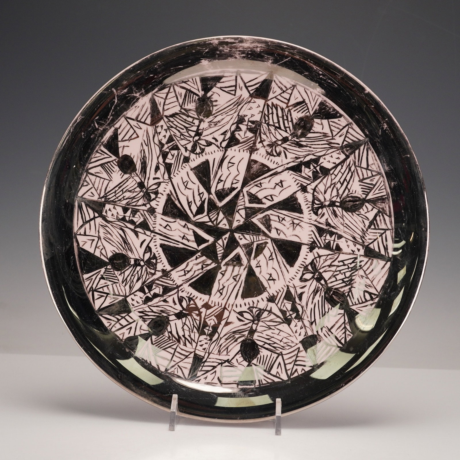 Wedgwood Bone China Decorative Plate, Alpine Pink: A Wedgwood 'Alpine Pink' abstract geometric bone china decorative plate crafted from bone china. This circular plate features a striking abstract and geometric design in black on a pale pink ground. T