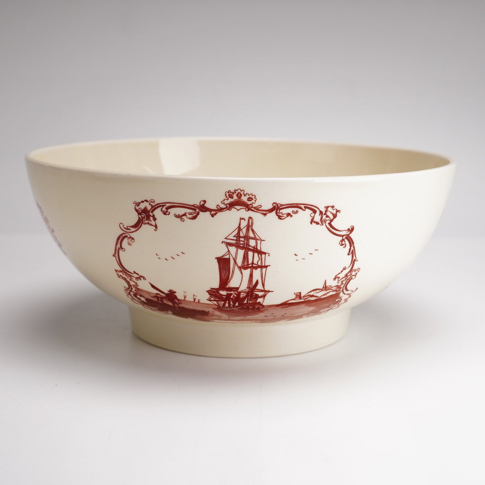 Wedgwood Reproduction Compass Bowl for Shreve, Crump and Low Co.: A Wedgwood creamware reproduction punch bowl, re-introduced by Shreve, Crump and Low Co. The exterior features red transfer-printed maritime motifs including a sailing vessel and a poetic couplet read
