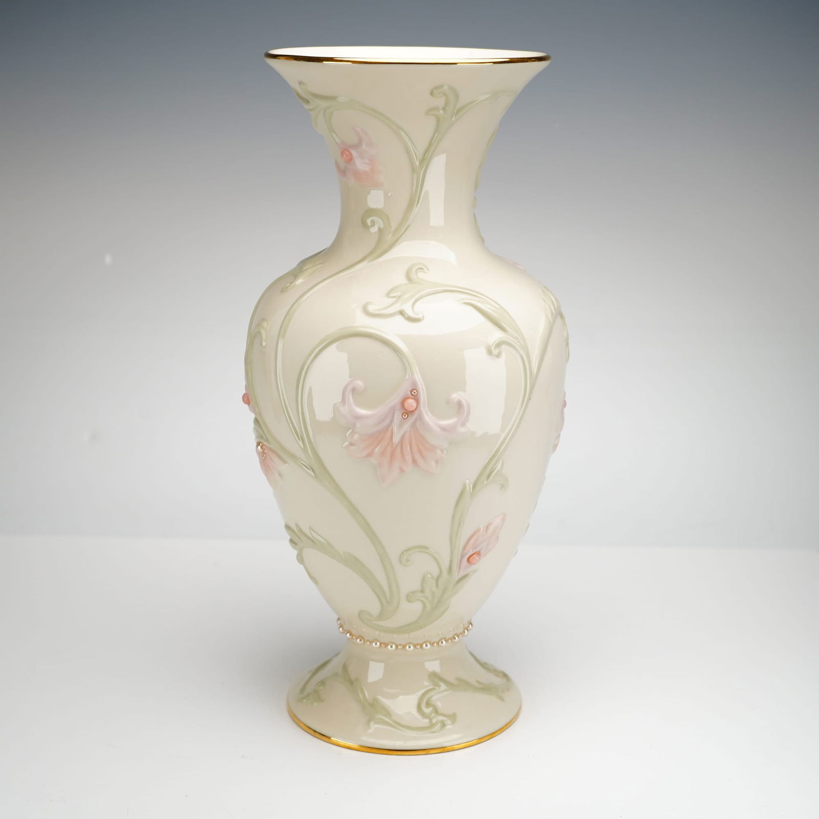 Lenox Gem Blossoms Statement Vase: A large Lenox ivory porcelain statement vase from the Gem Blossoms collection. This piece is designed in an elegant baluster form featuring a flared trumpet neck and a circular pedestal foot. The body