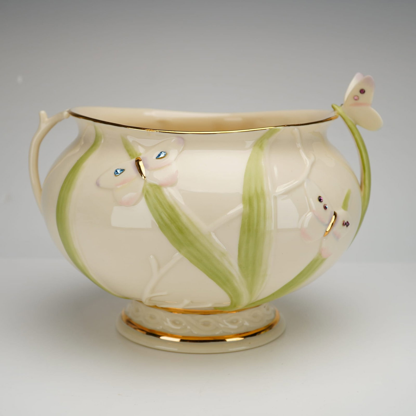 Lenox The Jeweled Butterfly Garden Bowl Porcelain Bowl: This Lenox fine ivory china porcelain bowl is designed in the Jeweled Butterfly Garden Bowl pattern. The bulbous, footed form features bas-relief molded butterflies and foliage. Each butterfly is acce