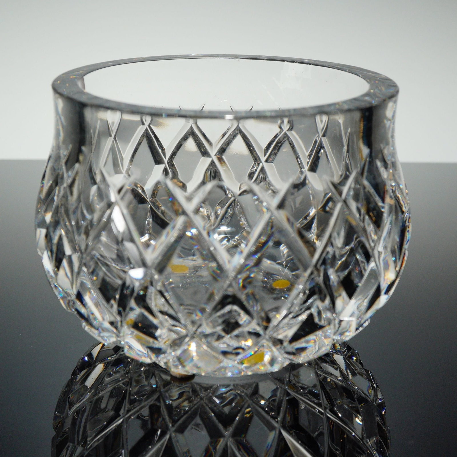 Orrefors So??ero Cut Crystal Bowl: A single Orrefors So??ero Crystal Bowl constructed of heavy, clear lead crystal or high-quality cut glass. The short, globular vessel is executed in the Brilliant Cut style, featuring deep, all-over e
