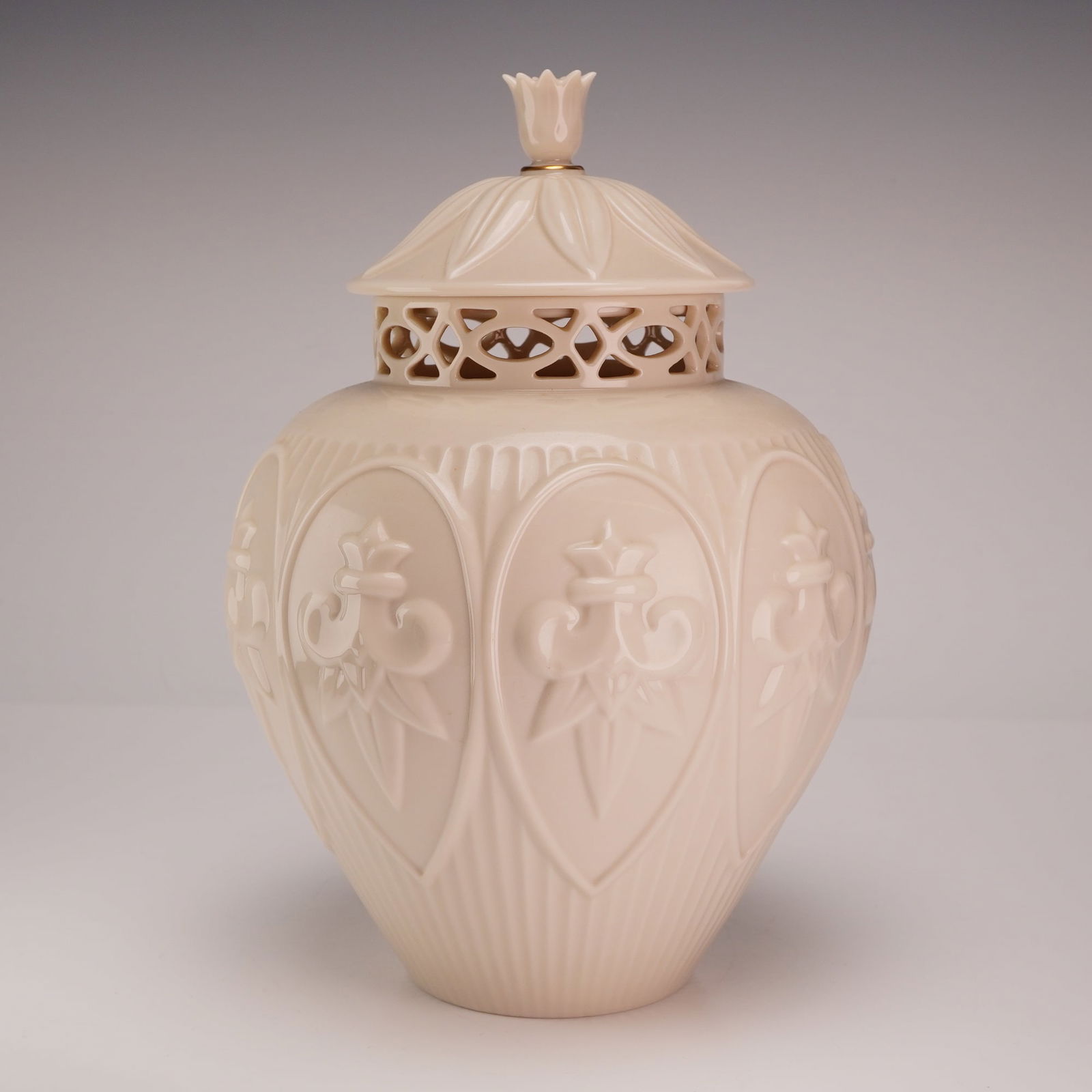 Lenox Matelasse Lidded Ginger Jar: Lenox porcelain ginger jar featuring an ivory porcelain body with embossed floral patterns and a pierced lid. Lenox backstamp. Dimensions7.00"L x 10.50"H Weight2.70 lb