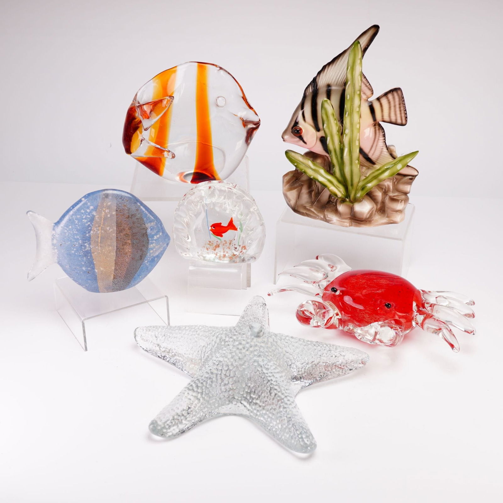 Robert Held, Murano, and Blenko Art Glass and Ceramic Marine Figurine Collection: This six-piece sea figurine grouping includes a variety of art glass and ceramic pieces. The collection features a hand-blown art glass fish by Robert Held, hand-signed on the base with thick vertical