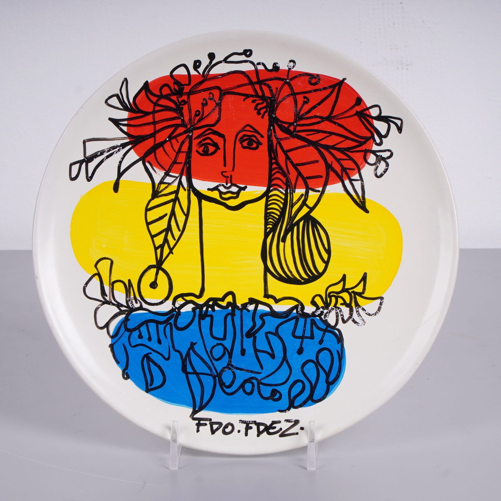 FDO.FDEZ (Cuban, b. 1962) Hand-Painted Porcelain Plate, Signed: A contemporary hand-painted decorative ceramic plate by Cuban Pop artist Fernando Fernandez, known by the signature FDO. FDEZ. The obverse features a white glazed ground decorated with a stylized face