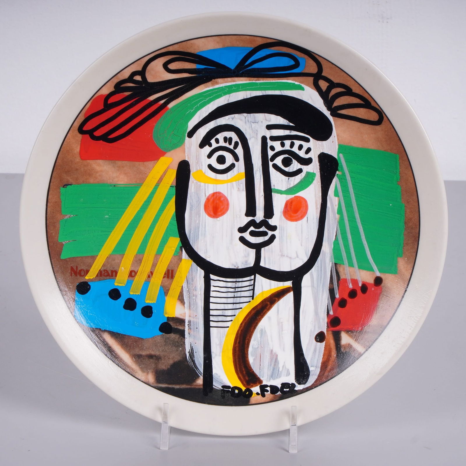 FDO.FDEZ (Cuban, b. 1962) Hand-Painted Porcelain Plate, Signed & Numbered: This circular porcelain plate features a hand-painted cubist-style portrait by Cuban artist Fernando Fernandez (b. 1962). Executed in a bold, expressive manner reminiscent of Pablo Picasso, the centra