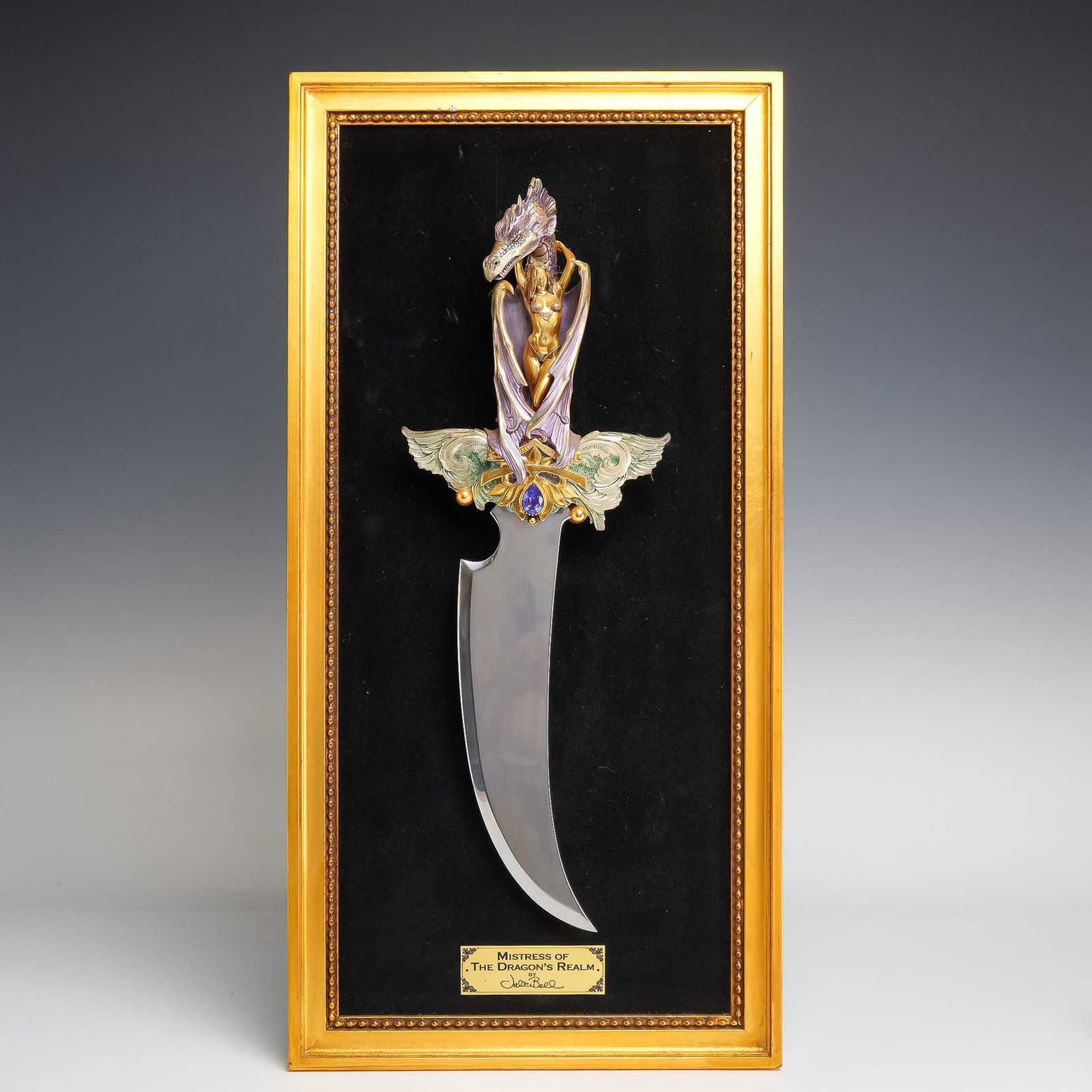 Chinese, Franklin Mint Fantasy Dagger, Late 20th Century: This Mistress of the Dragon's Realm dagger and display is a decorative civilian collectible manufactured by the Franklin Mint and designed by renowned fantasy artist Julie Bell. The piece features a h