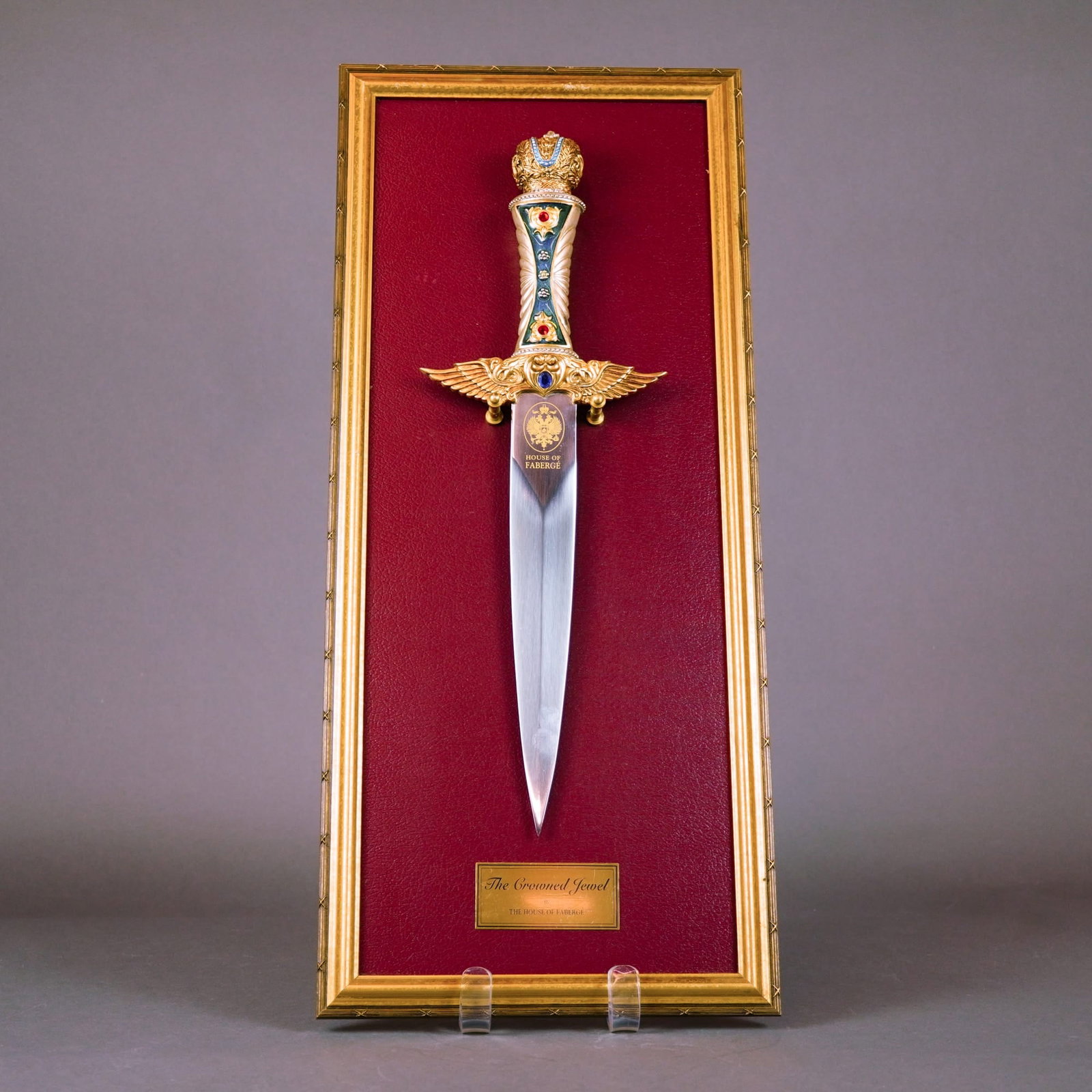 House of Fabergé, Decorative Commemorative Dagger, Late 20th Century: This decorative commemorative dagger, titled The Crowned Jewel, was designed by the House of Fabergé in collaboration with The Franklin Mint. Produced in the late 20th century, the weapon features a